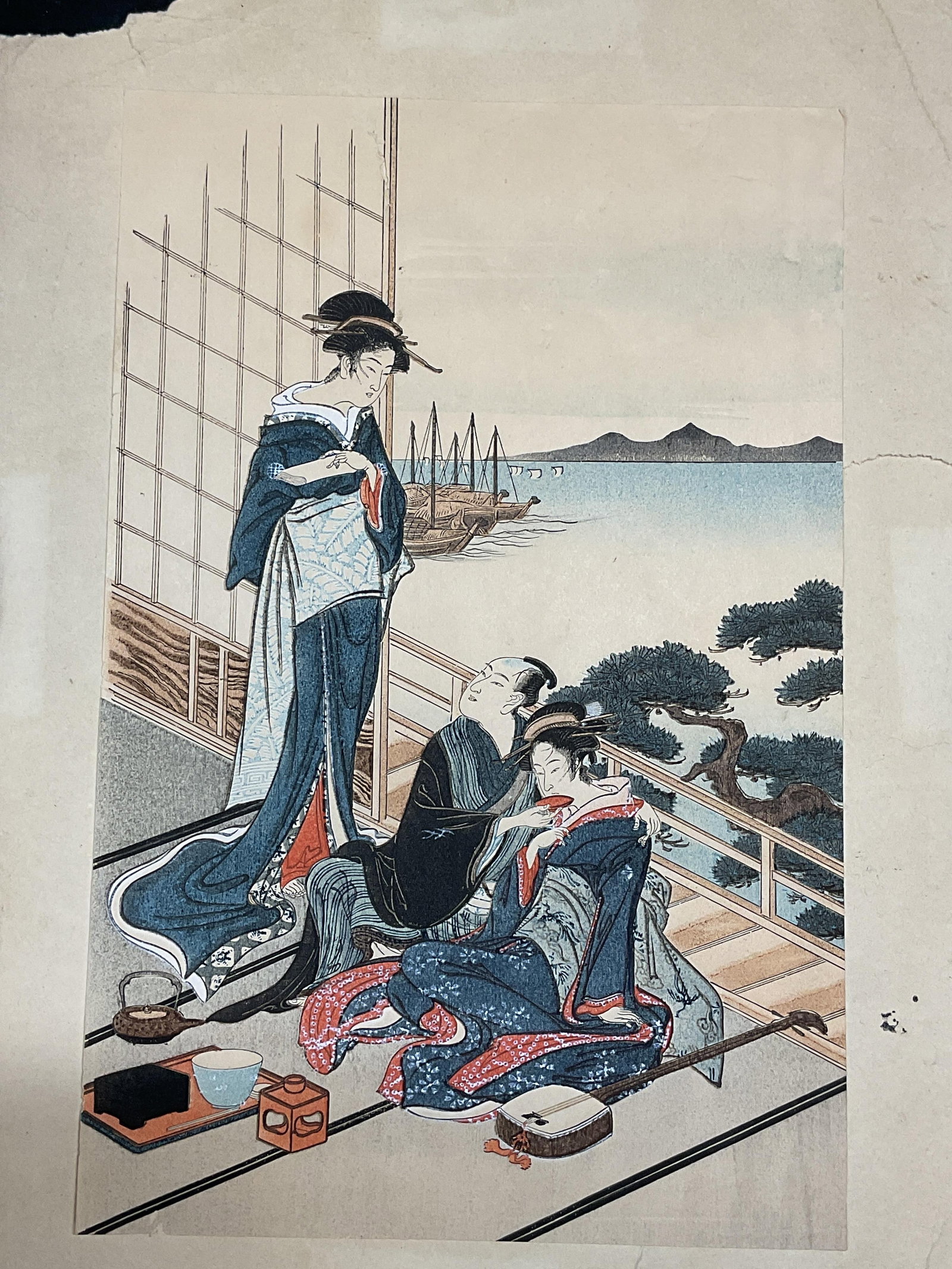 After Toyoharu Feast at Waterside Woodblock Print: Woodblock print in color on paper. After Utagawa Toyoharu, Feast At A Waterside Pavillion. Geisha and male figures. Paper measures approx 12 x 7.5 inches. Some small holes to paper. Art, fine art, hom