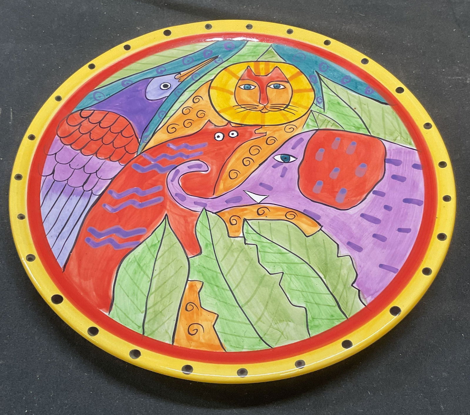 Vtg 1998 Laurel Burch Animal Ceramic Plate: Vintage 1998 Laurel Burch ceramic plate. Colorful animal design. Signed. Measures approx 8 inches wide. Some wear consistent with exposure. Laurel Burch plate, animal plate, ceramic plate, collectible