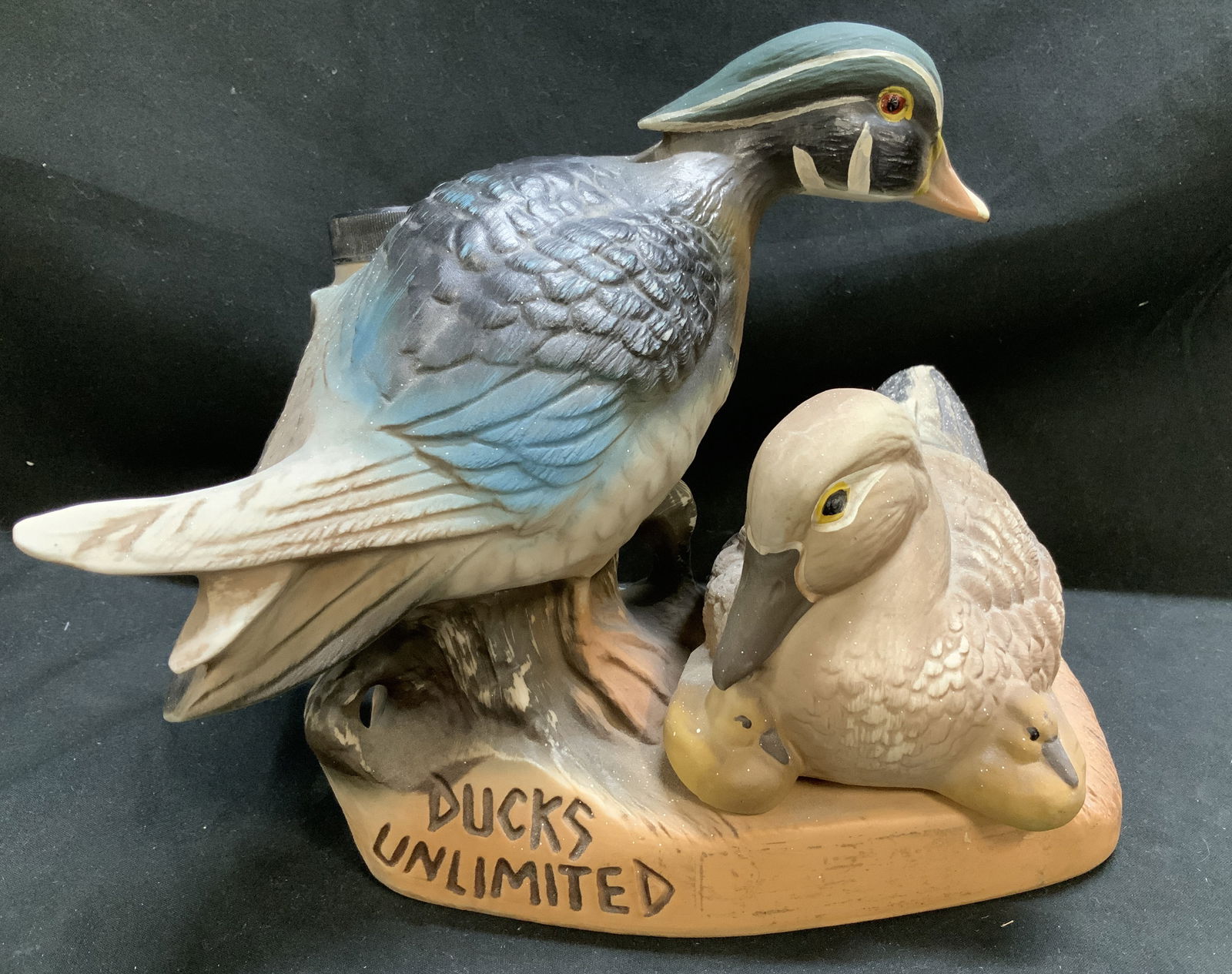 Vntg James B. Beam Ducks Unlimited Decanter USA: Decanter is made of regal china porcelain & features a male wood duck standing and a female wood duck with ducklings, resting on a tree stump. Signed & marked on underside. Reads, CREATION OF JAMES B.