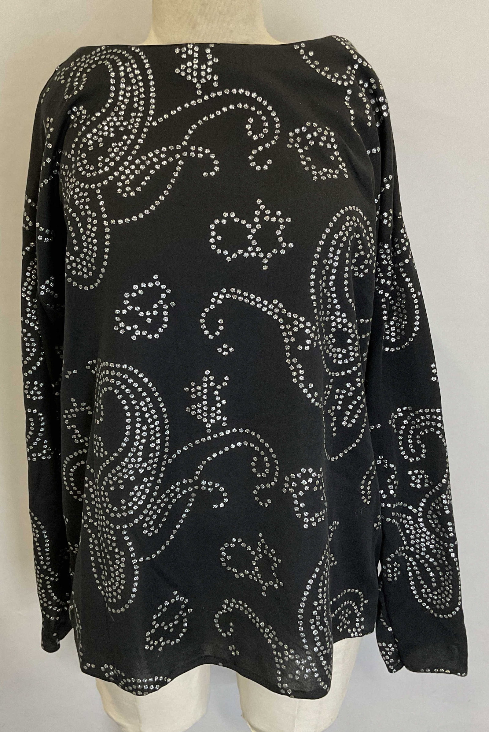 Black Long Sleeve Paisley Sparkle Top: Black long sleeve top with paisley pattern and silver tone sparkle. Measures approx 22 inches across chest. Material feels synthetic. Gently worn. Black top, sparkle top, paisley top, long sleeve top,