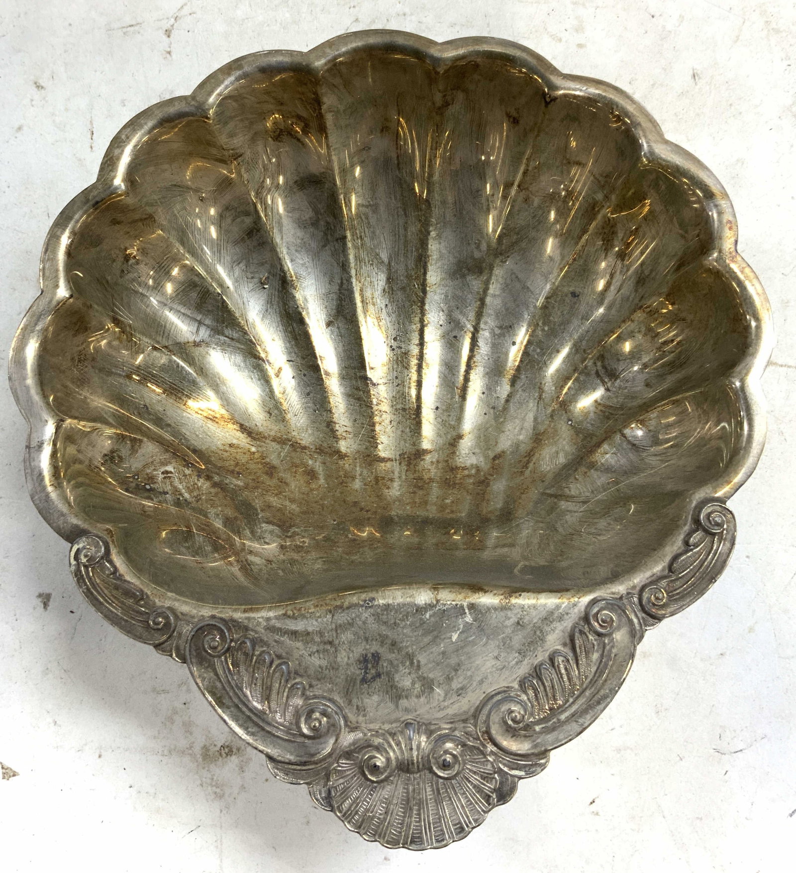Silver Plated Vtg Scalloped Seashell Dish W Feet: Dish is silver plated. Appears to be vintage. Dish has scalloped seashell form. Piece has c scroll detail & scrolled feet. Dish measures approximately 10 inches deep 9 inches wide, 3 inches tall. Silv
