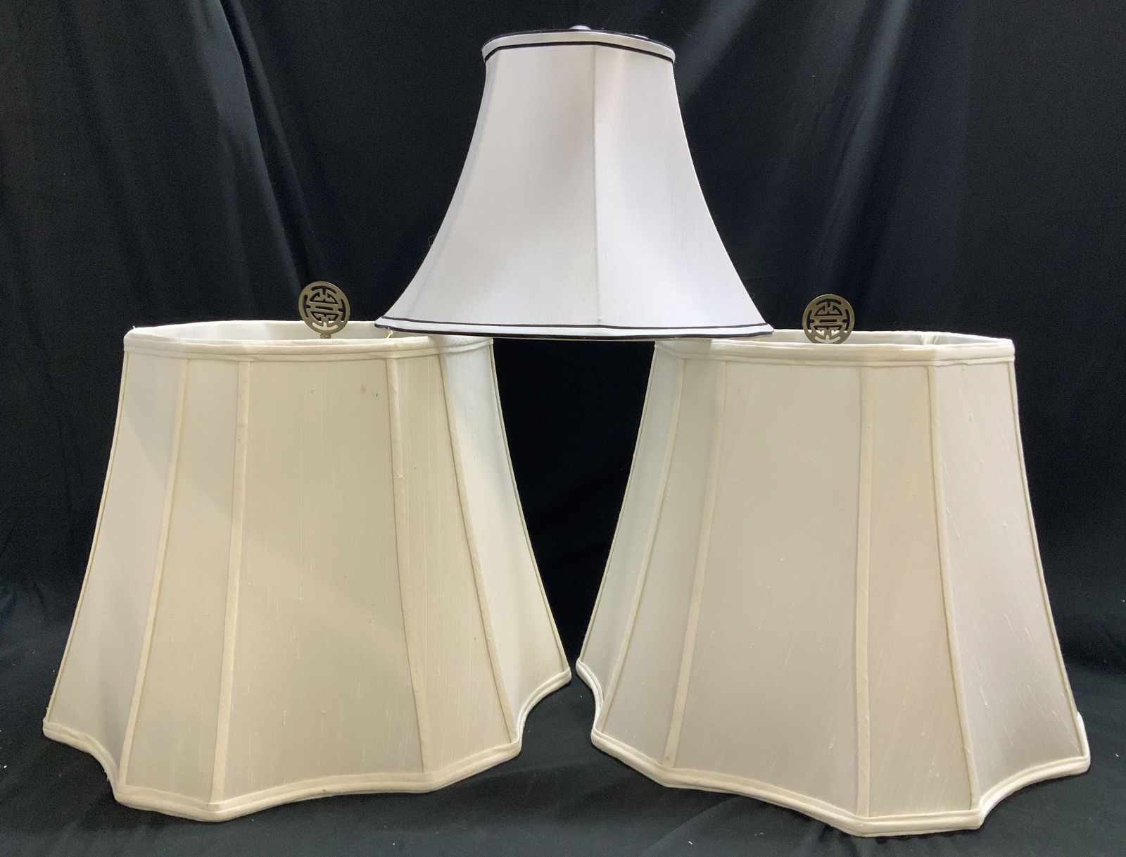 Lot 3 MCM Assorted Fabric Lampshades W Finial: Lot 3 MCM Assorted Fabric Lampshades W Finial Lot includes 3 assorted fabric lampshades varying in size. 2 lampshades feature a brass oriental finial. Signed & marked on 1 lampshade. Reads, AUTOMAX. S