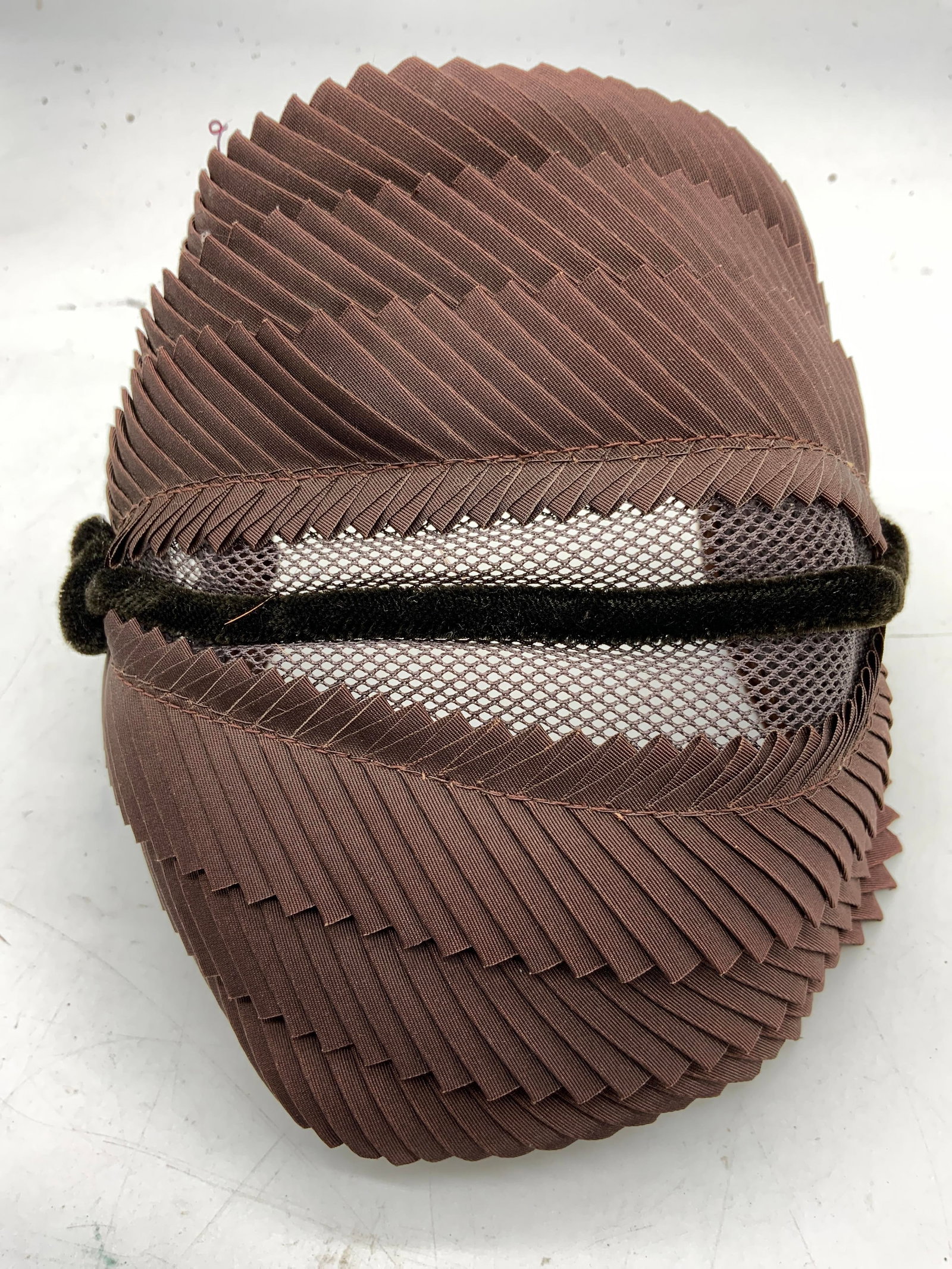 1950s Vintage Womans Headpiece Hat Brown: Headpiece is vintage circa 1950s. Piece is brown toned, frilled detail with netted underside. Measures approximately 6.5 inches long 5 inches wide 4 inches deep. Headpiece, vintage headpiece, womans h