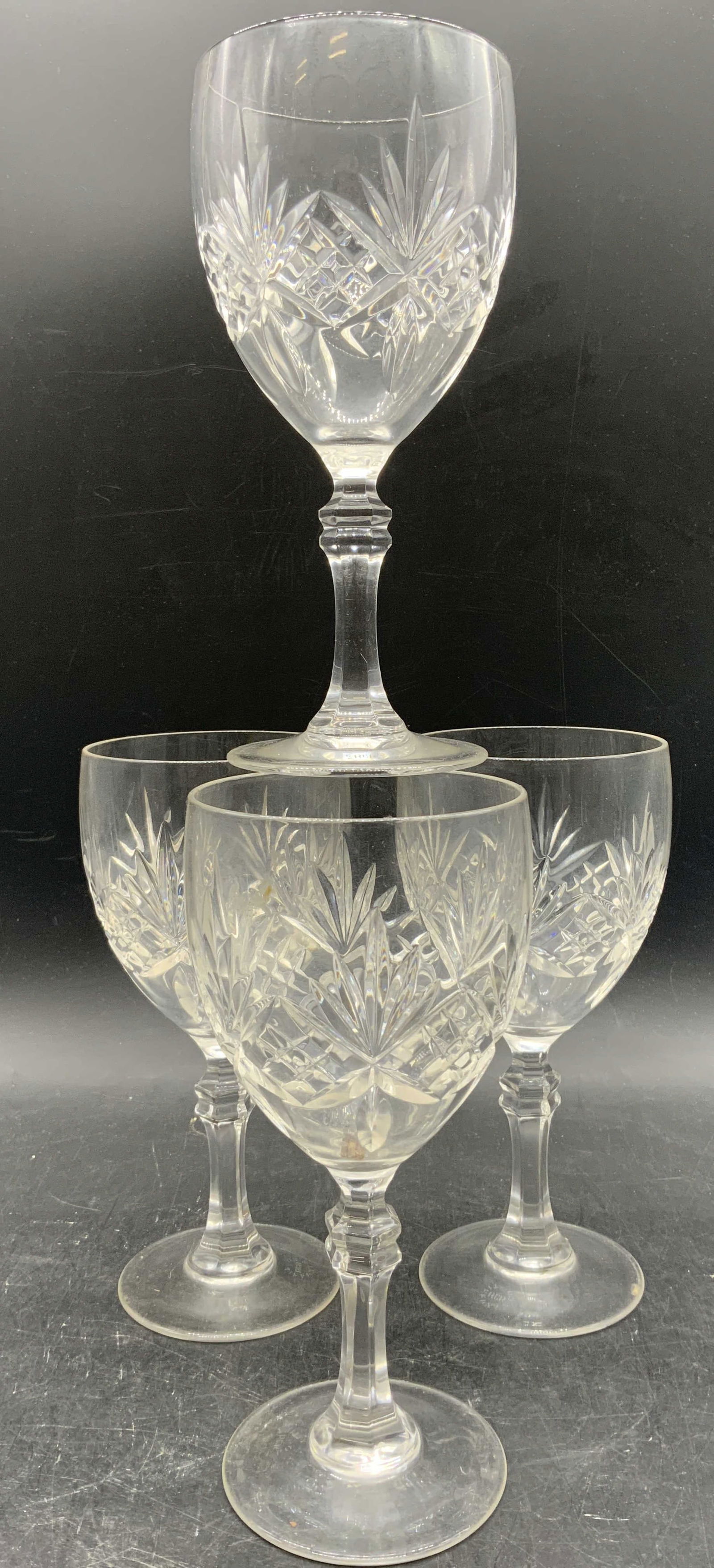 TIFFANY & CO RCR Set 4 Crystal Goblets: Undersides are marked TIFFANY & CO RCR. Lot includes 4 goblets. Each are crystal with geometric Relief detail. Crystal stemware each with circular for, bases. Vessels each measure approximately 7 inch