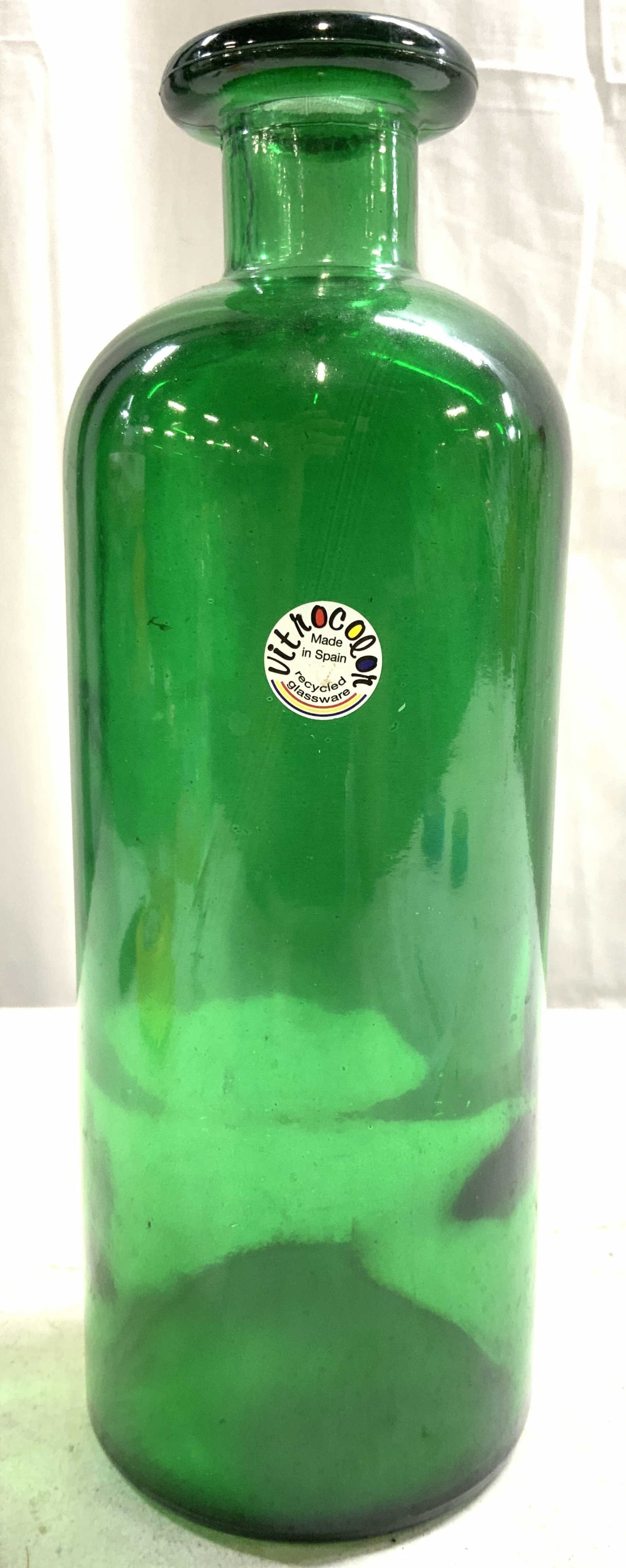 VITROCOLOR Vintage Art Glass Bottle Green SPAIN: Tag reads VITROCOLOR Recycled Glassware MADE IN SPAIN. Bottle is green toned and glass. Vessel appears to be vintage. Piece measures approximately 11 inches tall 4 inches wide. Bottle, glass bottle, g