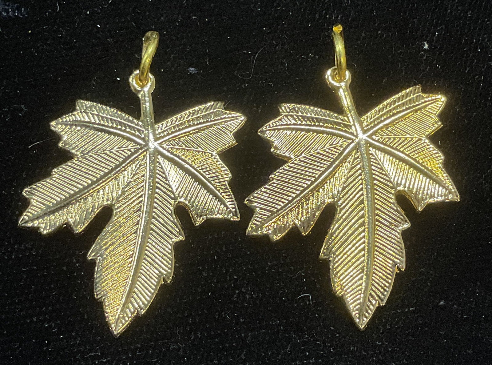 Pair Deborah Tree Of Life Leaf Pendants: Pair of Deborah Tree of Life gold tone leaf motif pendants. Signed. Measure approx 1.25 x 1 inches. Some wear including scratching. Jewelry, estate jewelry, costume jewelry, cocktail jewelry, fashion 