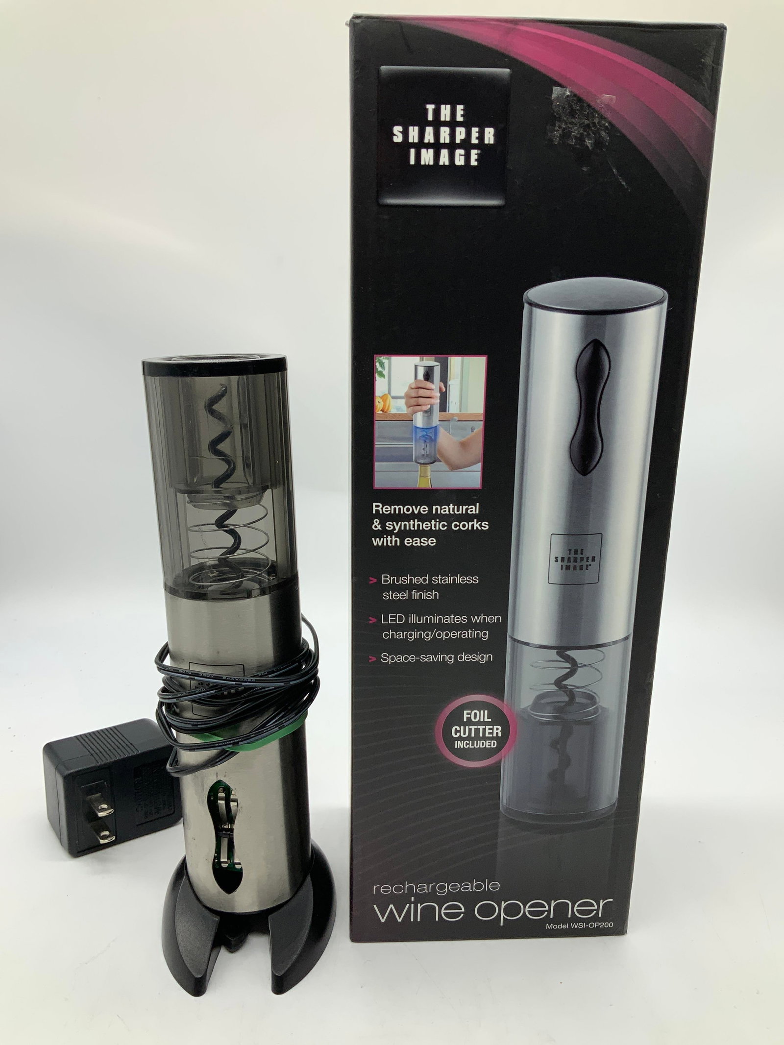SHARPER IMAGE Rechargeable Wine Opener W Box: SHARPER IMAGE Rechargeable Wine Opener W Box Rechargeable wine opener features a brushed stainless steel finish & removes natural/synthetic corks. Wine opener comes with instructions & original box. N