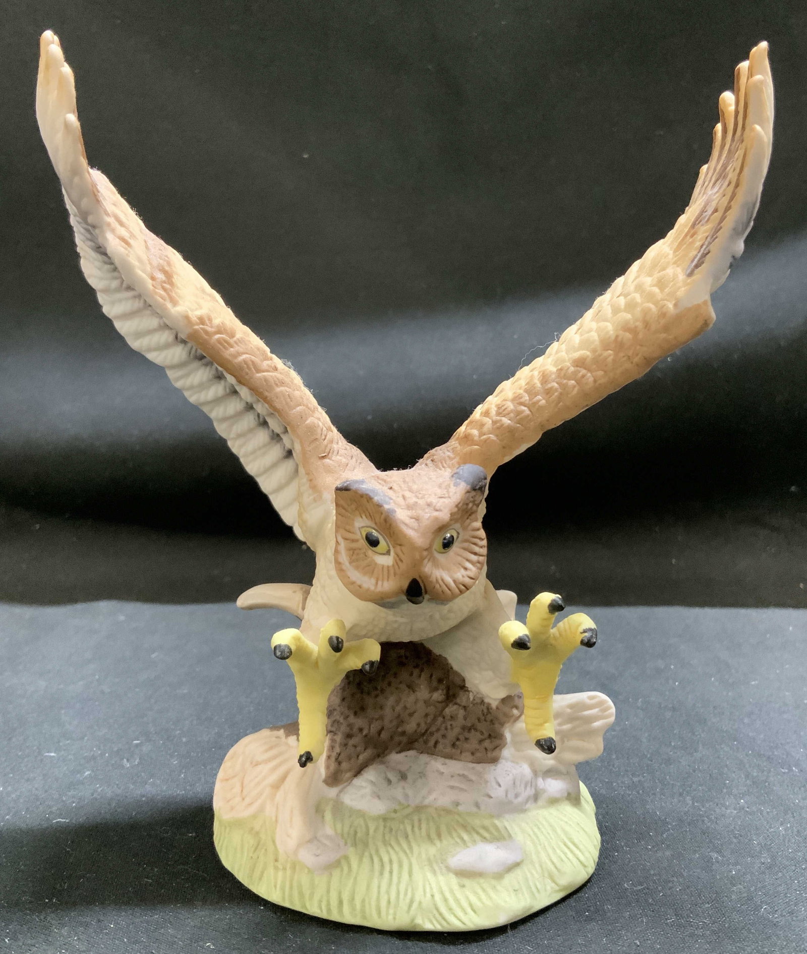 Royal Heritage Collection Owl Porcelain Sculpture: Porcelain sculpture depicting a Great Horned Owl with its wings spread. Owl is perched on a porcelain wooden base. Signed & marked on underside. Reads, ROYAL HERITAGE COLLECTION. PORCELAIN SCULPTURE C