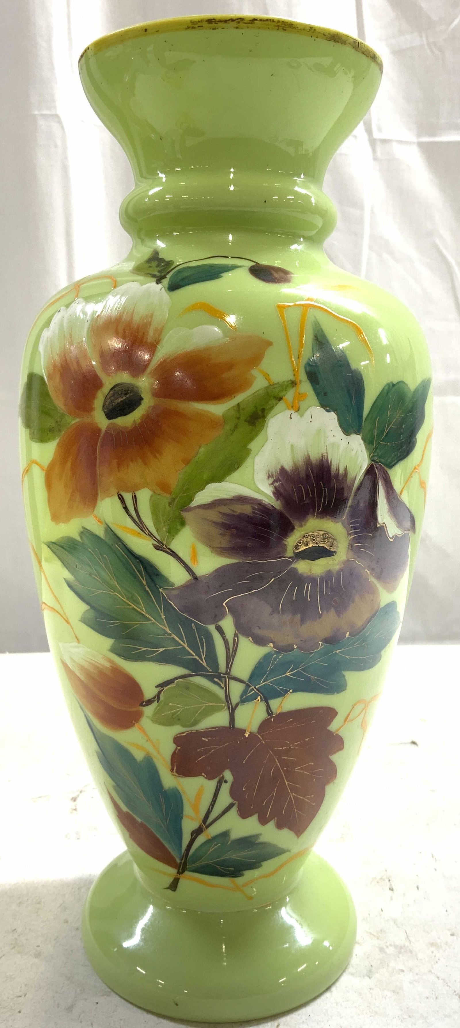 Antq19thC Victorian Opaline Gls Hnd Pntd Vase 12in: Vase appears to be antique possibly vintage. Piece is light green toned opaline glass with intricate multi toned floral and leaf detail. Vase is footed. Piece has gilt rim. Vase measures approximately