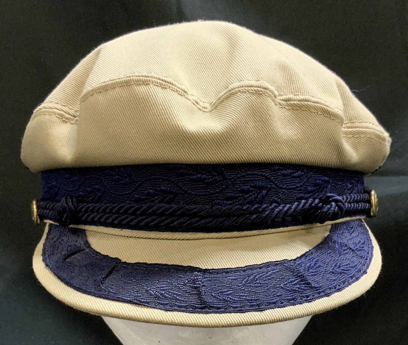 Vntg Quaker Marine Supply Co. Khaki Cap USA: Cap is a khaki color & features a navy blue visor & band, decorated with embroidered leaf detail & gilt button accents. Signed & marked. Reads, MADE IN USA. QUAKER MARINE SUPPLY CO. MEDIUM. Surface we