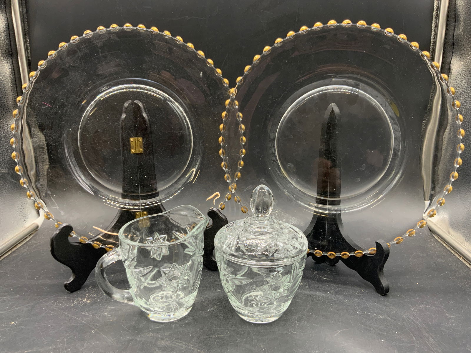 Lot 4 Tableware, Dalzell Candlewick Plates & More: Lot includes 2 Candlewick plates marked DALZELL on undersides with gilt beaded edges, 1 creamer dish & 1 sugar dish (includes lid). Each vessel has geometric relief detail. Plates each measure approxi