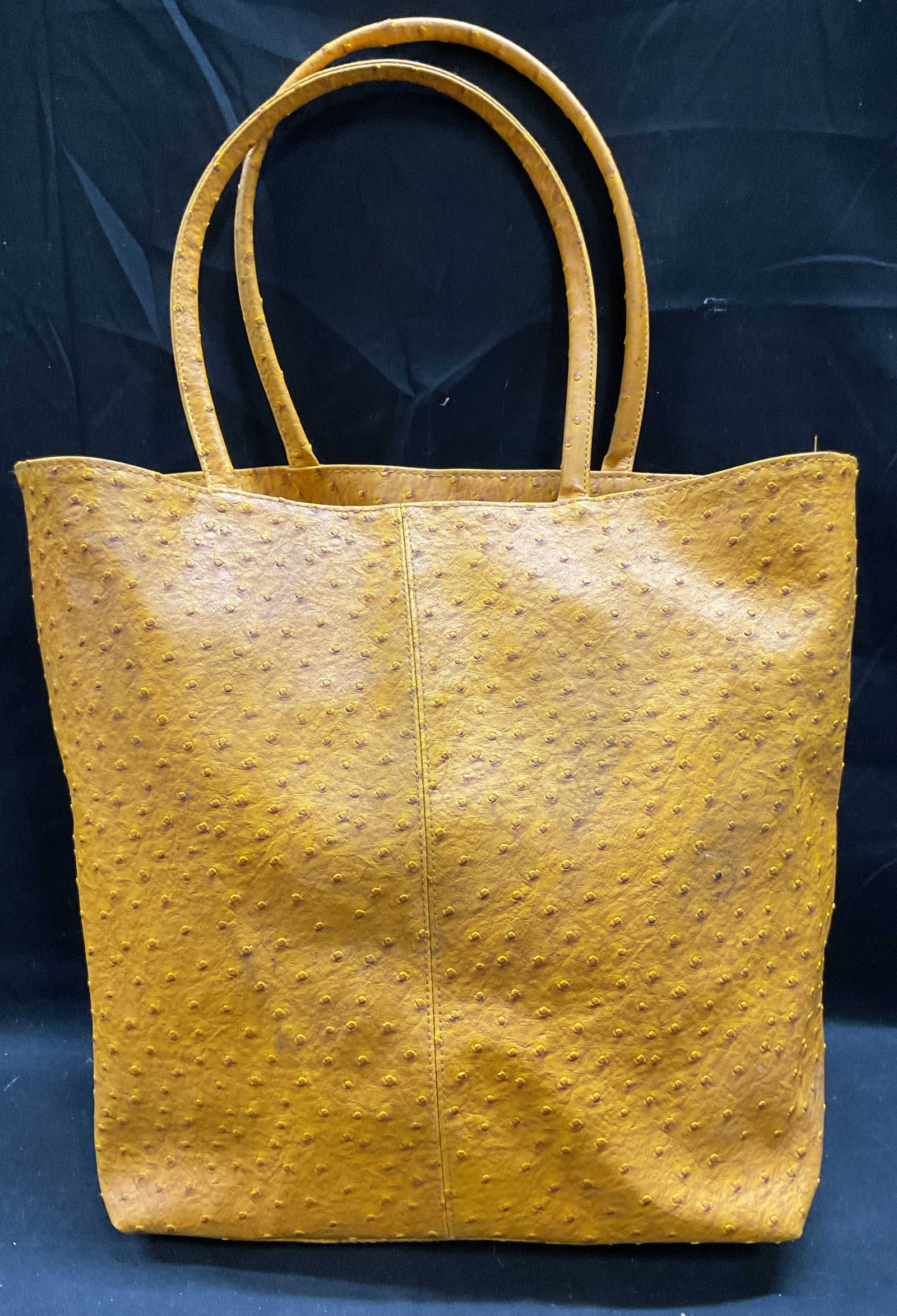 Yellow Faux Ostrich Leather Tote Handbag: Yellow faux ostrich style leather tote handbag. Synthetic outer and lining. Measures approx 12.5 x 5 x 15 inches. Some blemishes. Faux astride handbag, faux leather handbag. Yellow handbag, tote bag, 