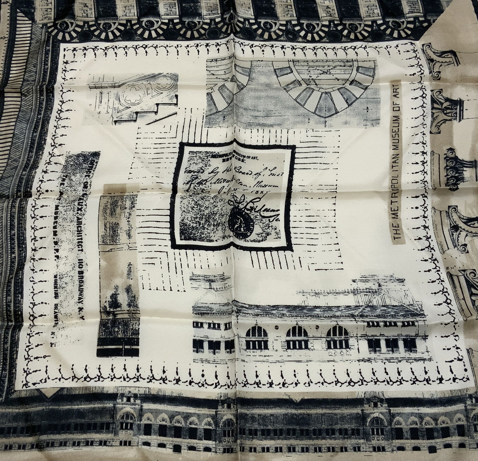 Metropolitan Museum of Art Arch. Silk Scarf ITALY: Metropolitan Museum of Art Arch. Silk Scarf ITALY Silk scarf featuring an architecture design in black & cream. Scarf is 100% silk. Signed & marked. Reads THE METROPOLITAN MUSEUM OF ART, MADE IN ITALY