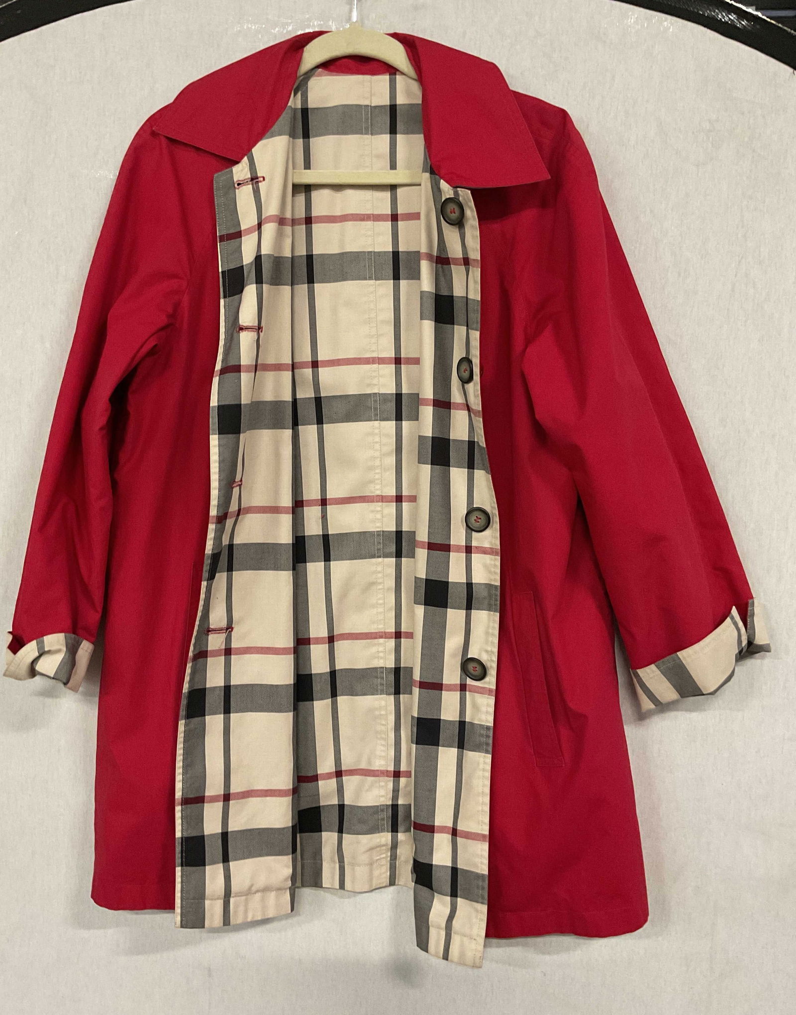 Reversible Red Tan Plaid Jacket: Reversible front button jacket. Solid red and tan plaid pattern. Feels like cotton. Measures approx 20 inches across chest. Some wear consistent with exposure. Reversible jacket, red jacket, tan jacke