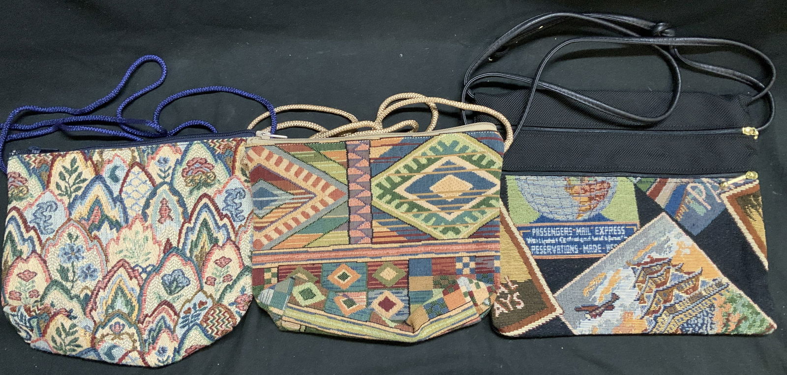 Lot 3 Vntg Tapestry Fabric Crossbody Bags: Lot includes, 3 tapestry crossbody bags featuring colorful designs. One with a floral motif pattern, one with a geometric southwestern style & post card style. Surface wear consistent to age, use & ex