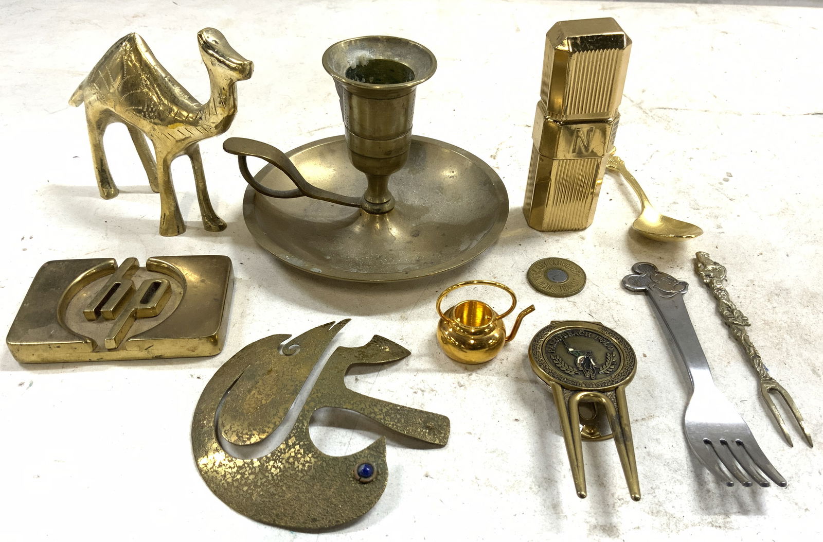 12 Tabletop Accessories, Walt Disney, NORELL, USA+: Lot includes 1 camel figure, 1 HP logo, paperweight, label on underside reads Handmade for the New Jersey Area Dealer District Exclusively by Dry Dock Metals NY NY address, 1 candlestick marked made i