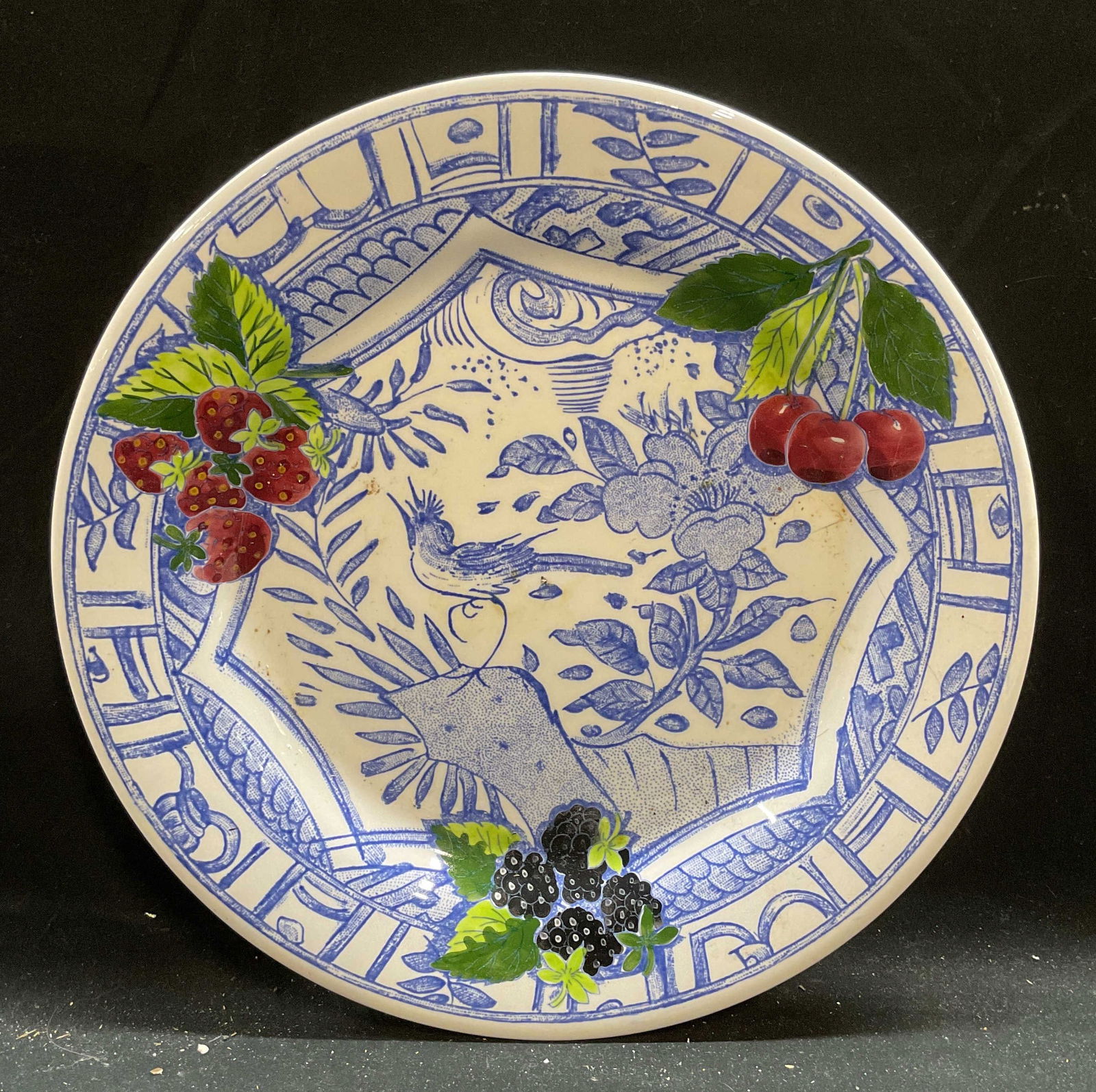 Gien Oiseau Bleu Bird Berry Ceramic Plate France: Gien ceramic dinner plate. Oiseau Bleu pattern. Bird with cherry, strawberry, and blackberry motif. Signed. Made in France. Measures approx 10.75 inches. Some scratches. Gien, Gien Oiseau Bleu, Gien p