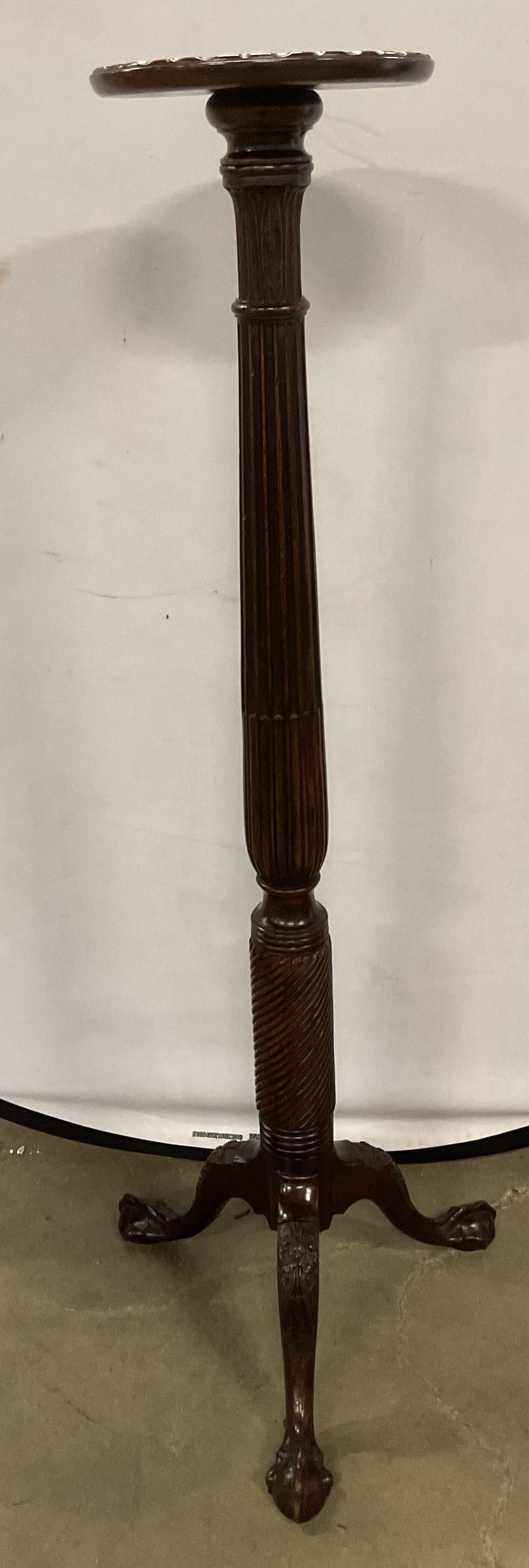 Antique Carved Wood Torchiere Pedestal 4Ft+: Antique wooden torchiere or pedestal stand. Carved wood details. Decorative carved column with curved tripod base and ball and claw feet. Measures approx 19 x 19 x 56 inches. Some scratches observed. 