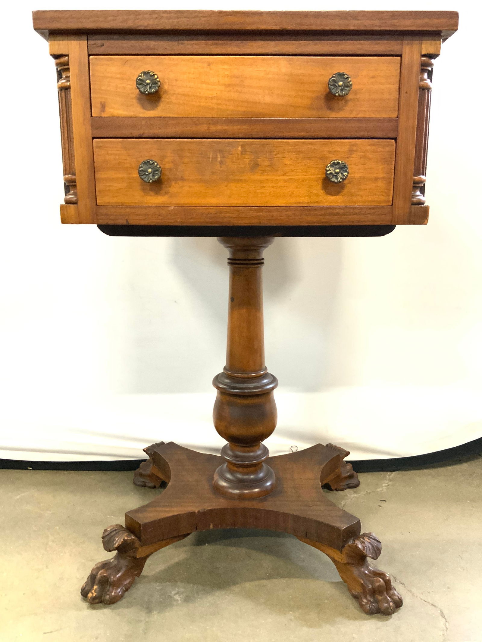 DUNCAN PHYFE Style Side Tbl W Lion Claw Feet 30in: Table is Duncan Phyfe style. Piece is light brown toned and wooden. Table has 2 drawers, each with gilt metal knob handles and hand dovetailing. Side table is pedestaled. Piece has carved lion paw and