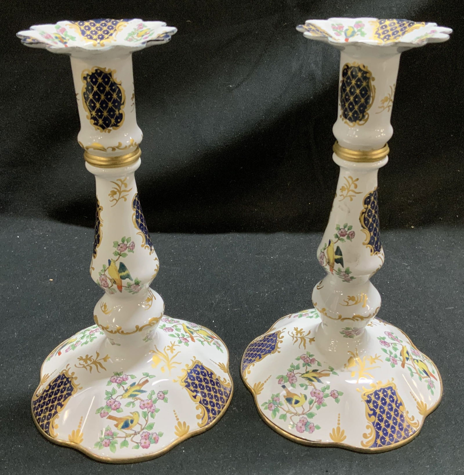 Vntg Pair Halycon Days Enamel Candlesticks ENGLAND: Vntg Pair Halycon Days Enamel Candlesticks ENGLAND Candlesticks are made of enamel material & feature a round scalloped foot. Candlesticks feature intricate floral & bird motifs with gold accents. Sig