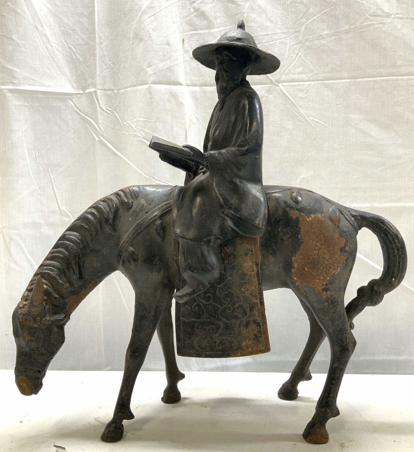 Vntg Cast Iron Toba Riding Mule Sclptr JAPAN 18in: Vntg Cast Iron Toba Riding Mule Sculpture JAPAN Sculpture is cast iron material & features an old Asian man riding a horse. Believed to be depicting Toba, a Japanese scholar, being exiled on mule. He