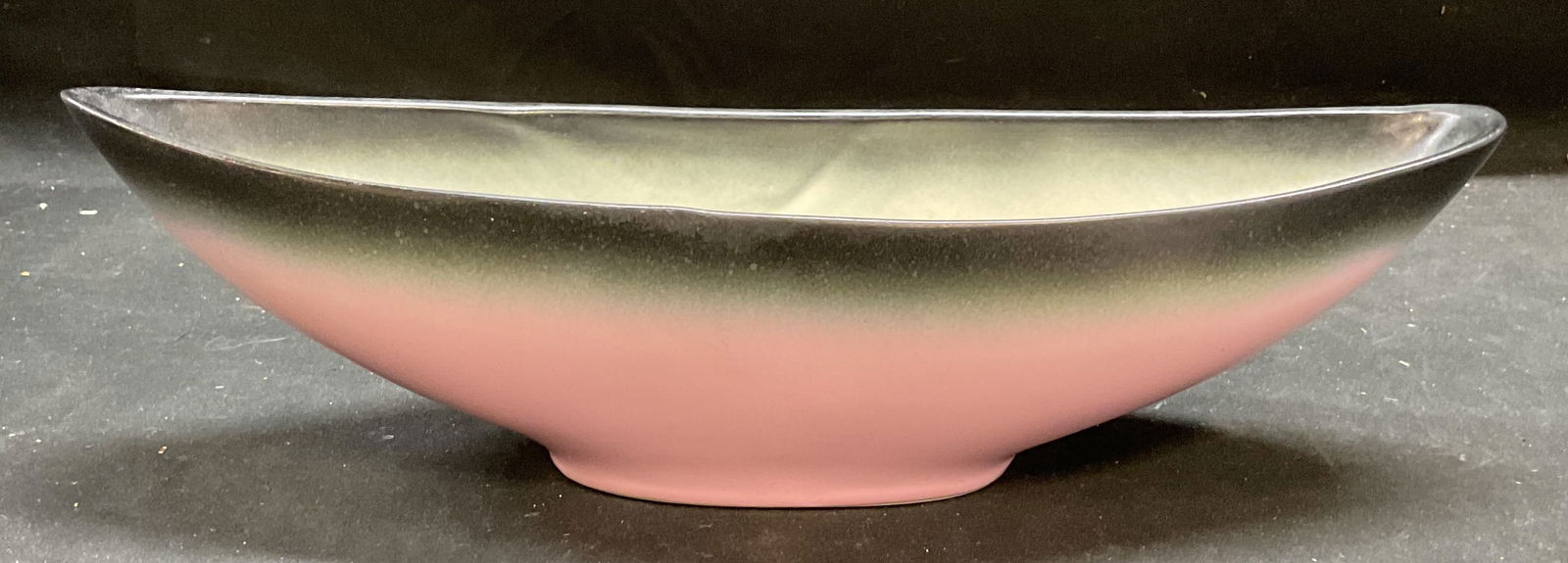 Vtg MCM Stanford Sebring Pink Art Pottery Bowl USA: Vintage mid century modern Stanford Sebring art pottery bowl. Footed bowl. Wide oval shape. Ombre black to pink glaze. Signed. Made in USA. Measures approx 13.25 x 3.75 x 3.75 inches. Some wear consis