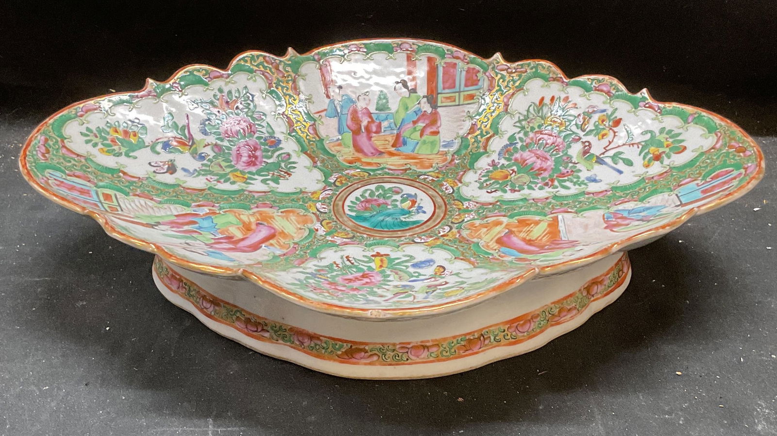 Antique Chinese Rose Medallion Porc Footed Dish: Antique Chinese porcelain footed dish. Rose Medallion pattern. Palette of pastel green and pink. Hand painted with gilt decoration. Cartouches of traditional Asian figures and flowers. Lozenge shale w