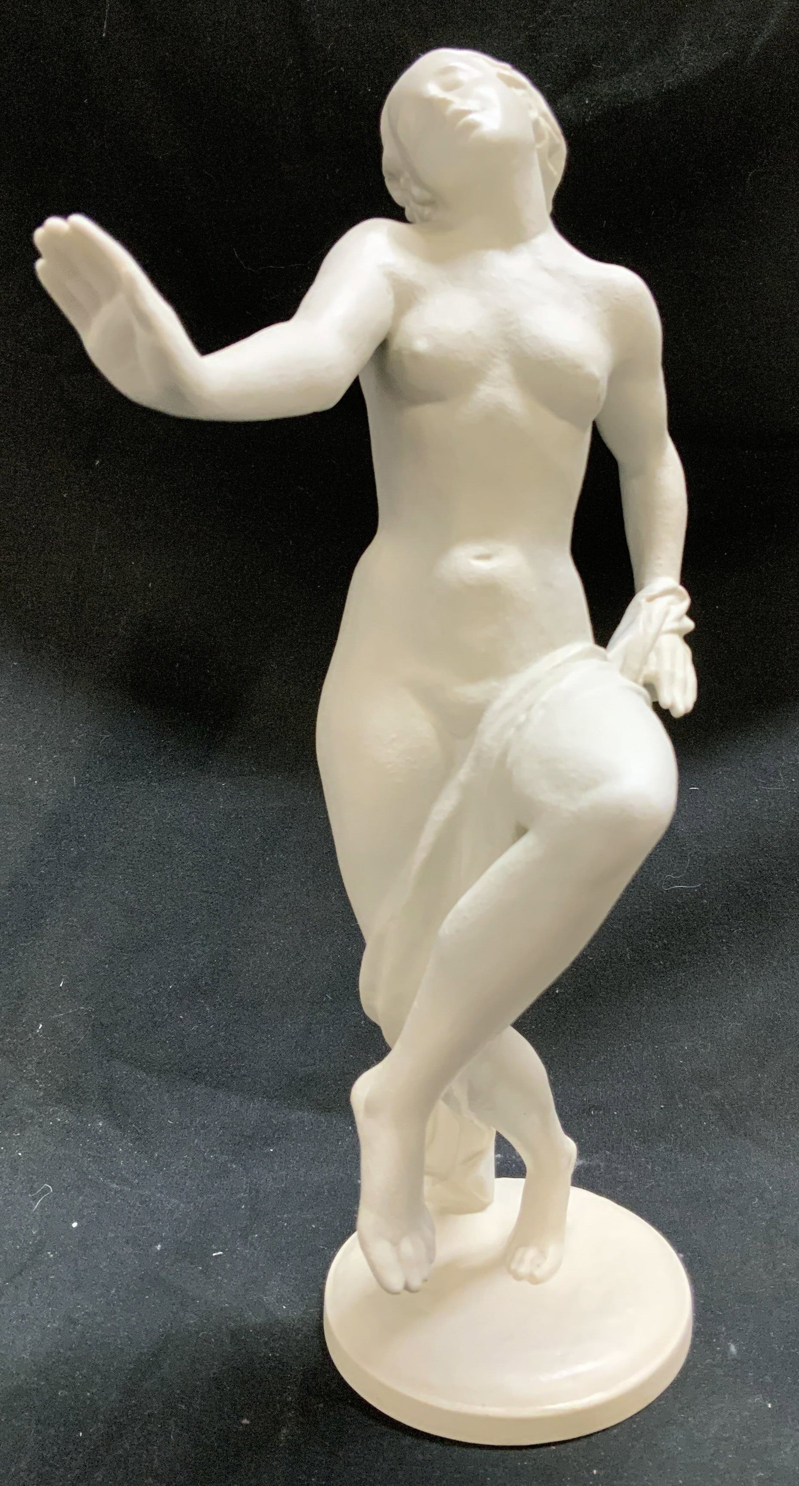 ROSENTHAL Greek Nude Woman Porc Figurine: ROSENTHAL Greek Nude Woman Porc Figurine Porcelain figurine depicting a nude female figure. Female figure is depicted in a dynamic pose, with one leg crossed over the other and arms raised. Signed & m