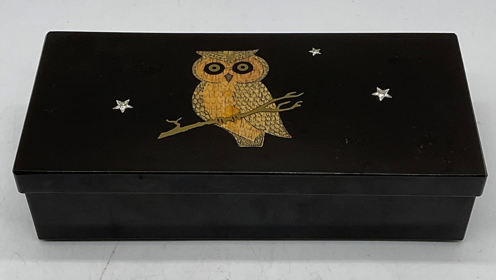 Vtg COUROC Satin Black Brass Crystal Owl Box USA: Vintage COUROC satin black bow with owl motif. Perched owl and stars. Inlaid wood, brass, and crystal. Hinged lid. Signed. Made in California, USA. Measures approx 8.5 x 4 x 2 inches. Some scratches. 