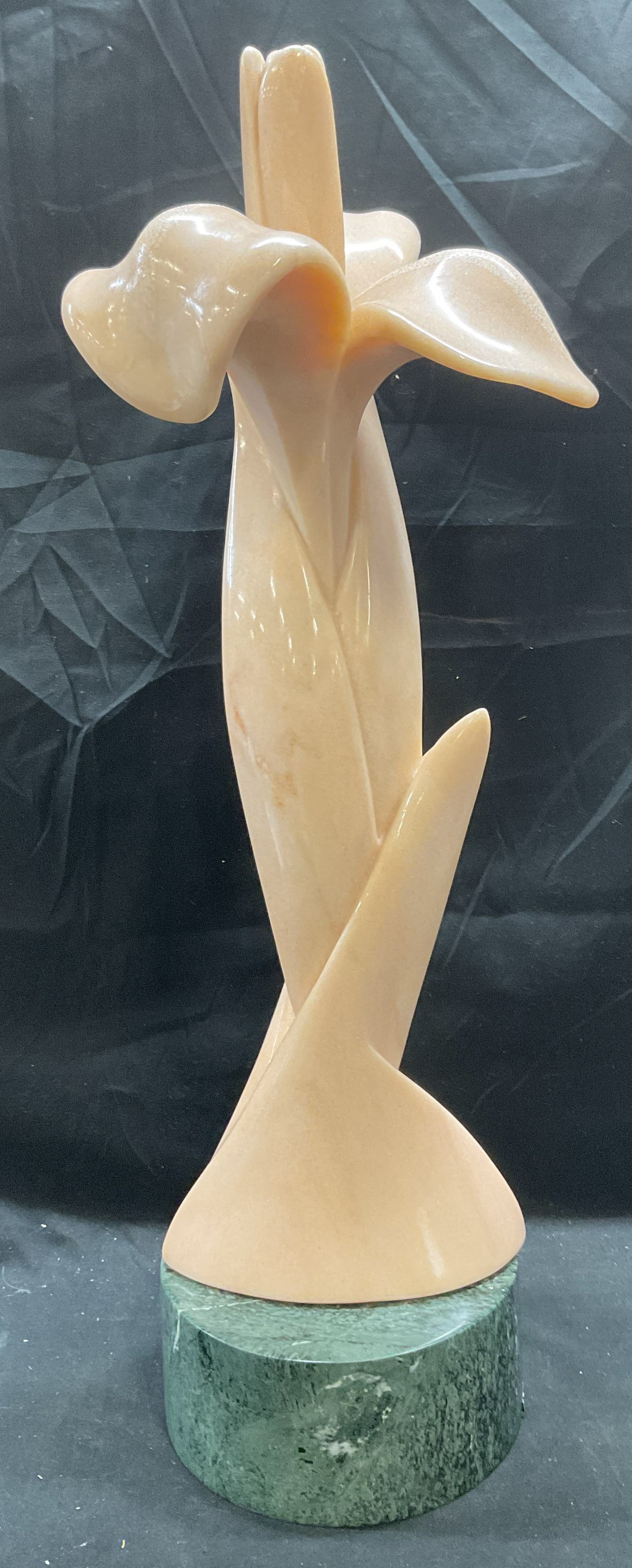Sgn Thea Tewi Orchid Flower Marble Sculpture 26in: Carved pink marble orchid flower sculpture with green marble pedestal. Signed and dated on reverse, Tewi 1986. Sculpture measures approx 8.5 x 11.5 x 26 inches. Pedestal measures approx 8 x 4 inches. 