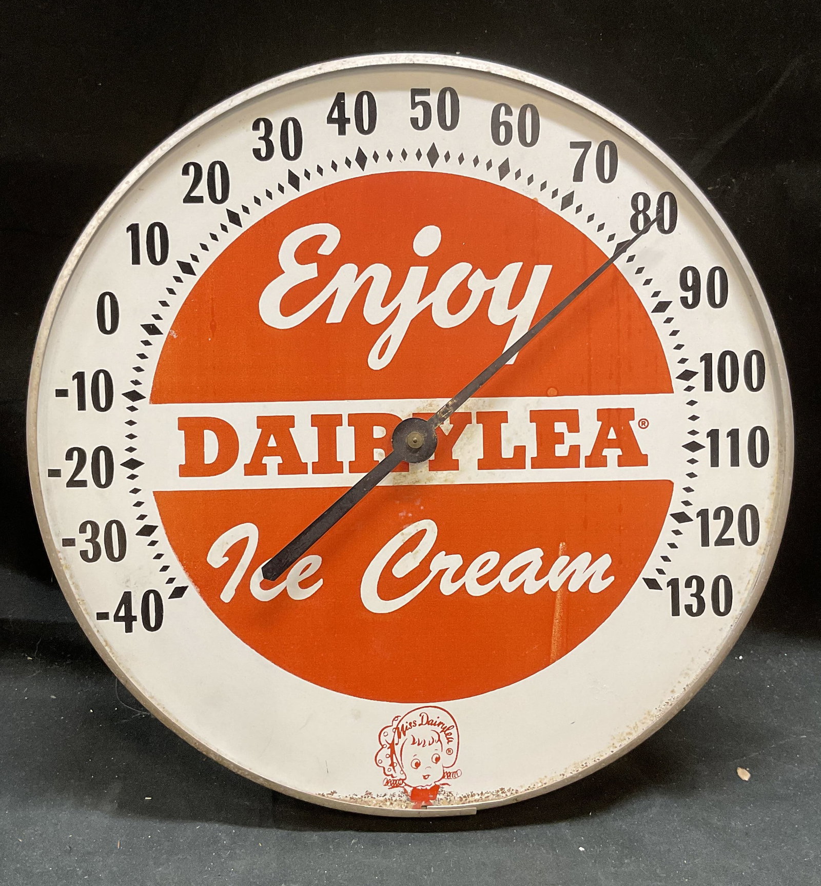 Vtg Dairylea Ice Cream Advertising Thermometer: Vintage Dairylea advertising thermometer. Reads Enjoy Dairylea Ice Cream with image of a girl at lower center. Red and white enameled metal. Measures approx 12 inches wide. Some loss to enamel, scratc