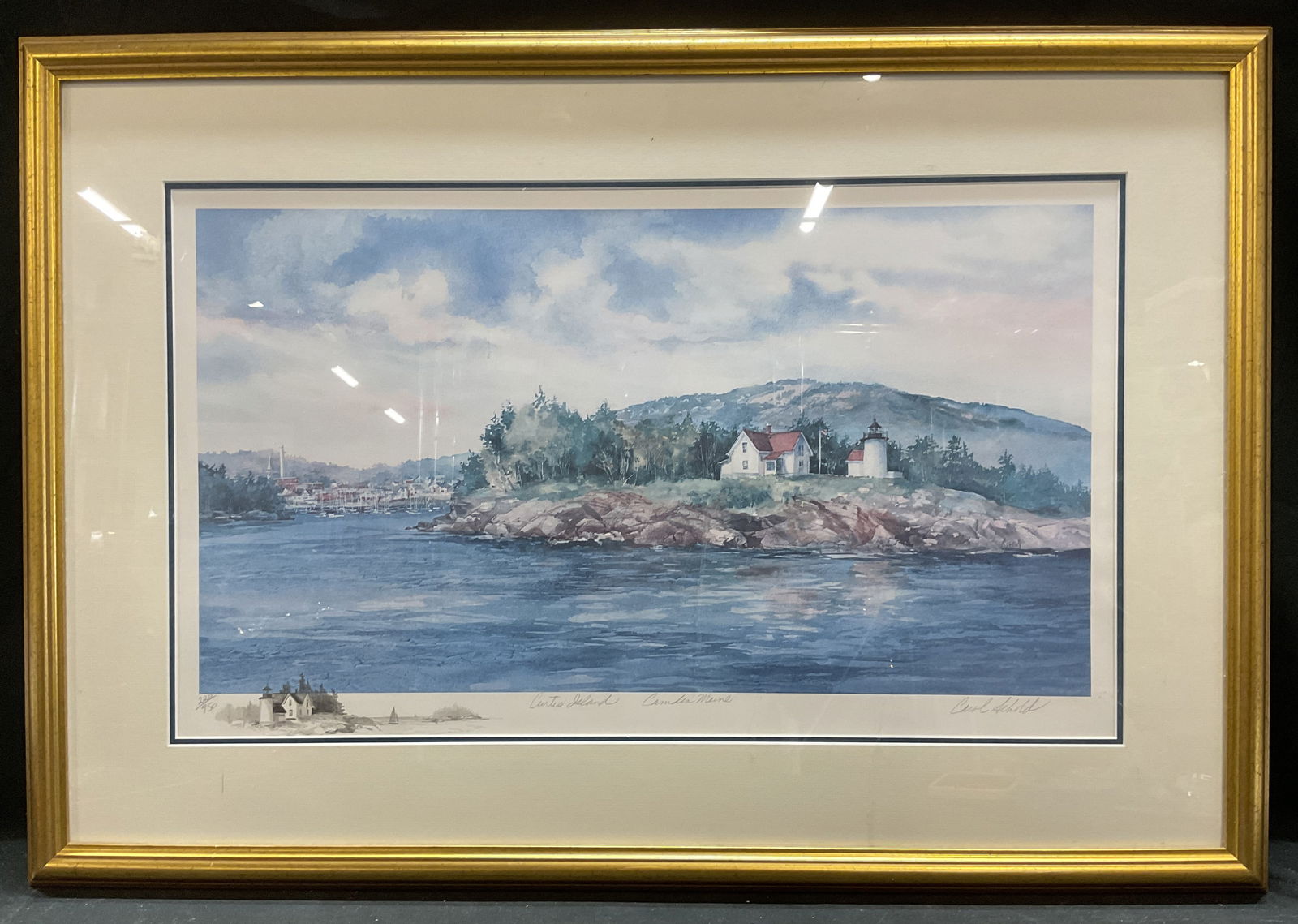 Signed Carol Sebold Curtis Island Maine Litho 32in: Framed and matted limited edition lithograph on paper. Signed lower right and verso, Carol Sebold. Maine scenery. Curtis Island, Camden, Maine. Edition number 220/950. Pencil sketch at lower left marg