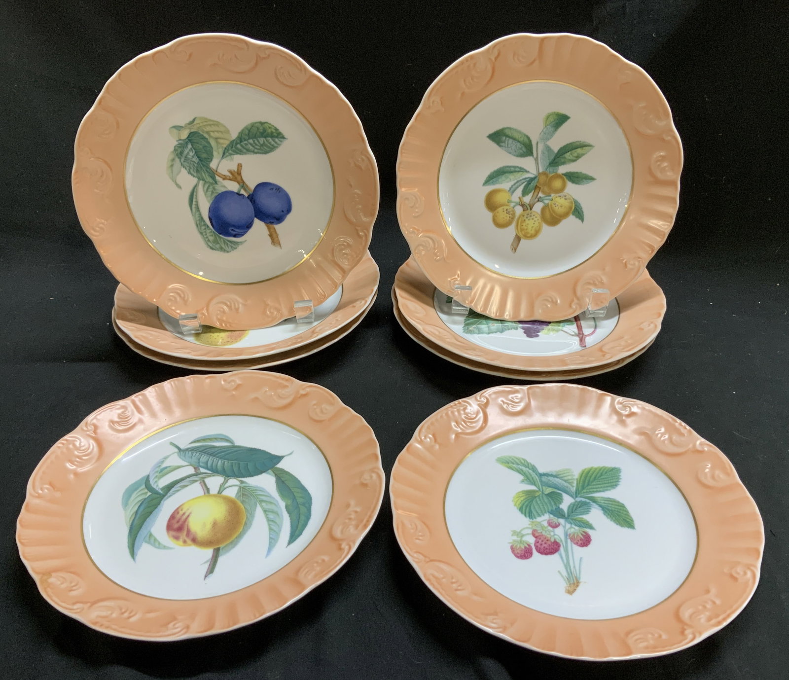 Set8 Mattahedeh Summer Fruit Plates PORTUGAL: Plates are from Mattahedeh Summer Fruit collection. Includes various fruit designs, such as apples, apricots, cherries, grapes, peaches, pears, and strawberries. The outer rim of the plate is a soft p
