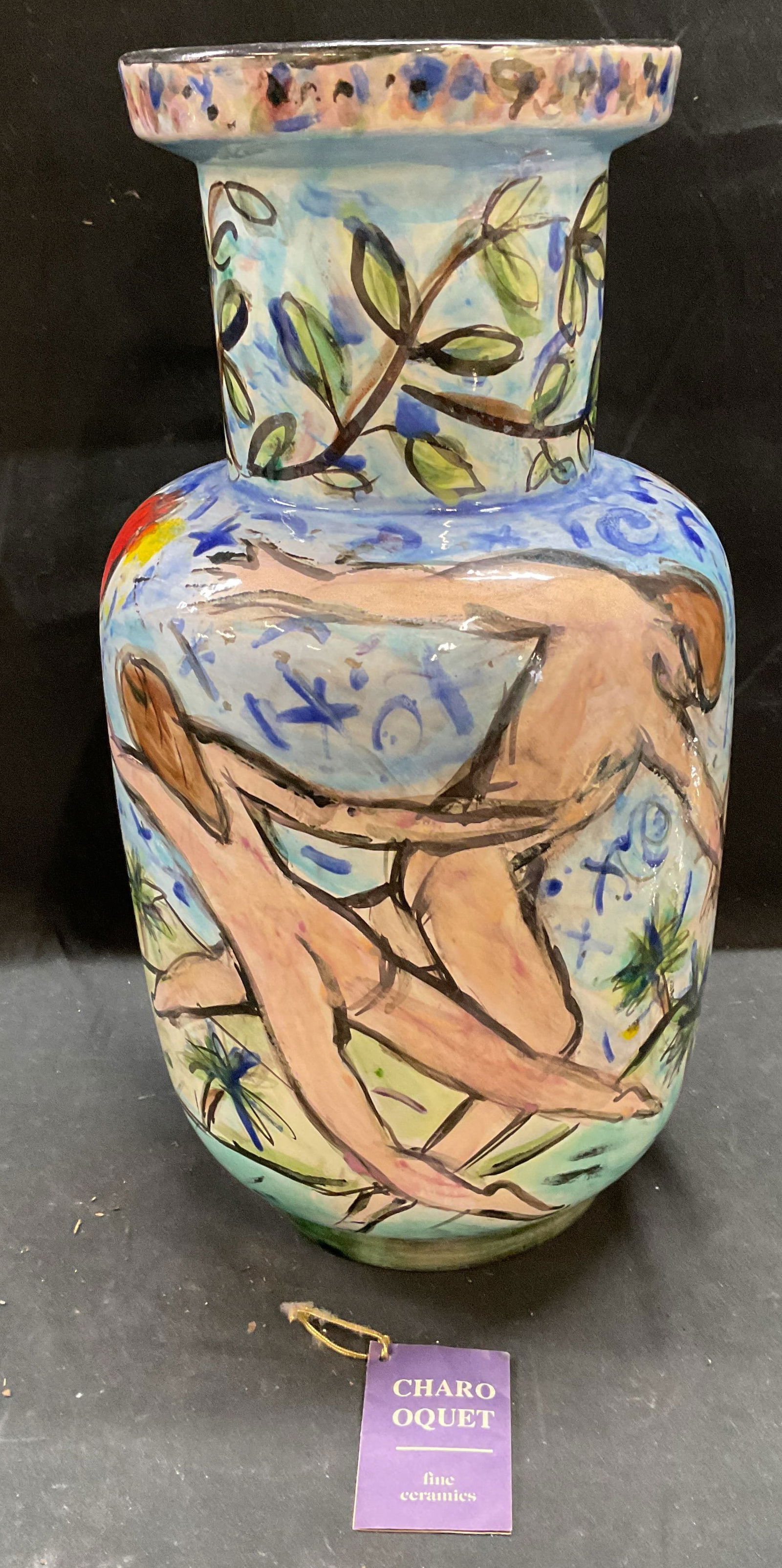Charo Oquet Dancing Nudes Ceramic Vase: Vintage signed Charo Oquet ceramic vase. Signed on underside. Dated 1992. Hand painted. Male and female nude figures dancing. Measures approx 7.5 x 15 inches. Some wear consistent with exposure. Charo