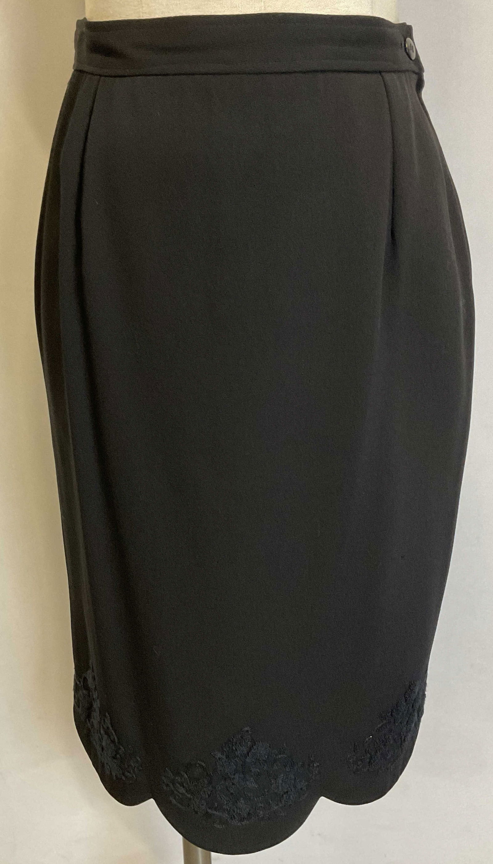 Valentino Black Embroidered Scalloped Skirt, Italy: Valentino Miss V black midi skirt with scalloped hem and embroidered floral decoration. Size 10/44. Made in Italy. Feels like wool, material label illegible. Fully lined. Side zipper and button. Gentl