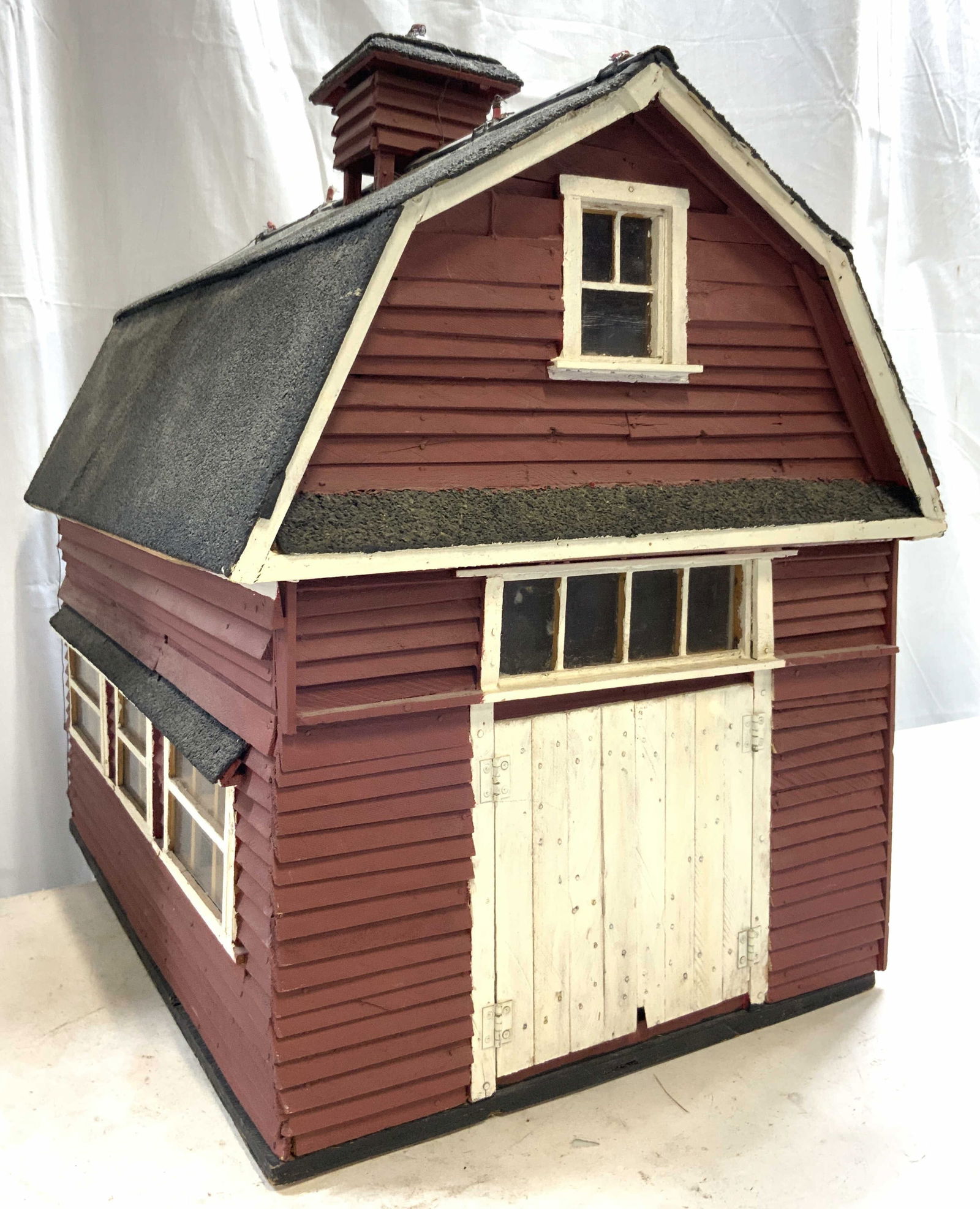 HO/N Vintage Wooden Scale Barn Model Kit: Barn model is vintage. Piece is red black and white toned. White toned barn doors open. Top of piece has chimney. Barn model has numerous windows. Piece appears to be wooden. Measures approximately 22