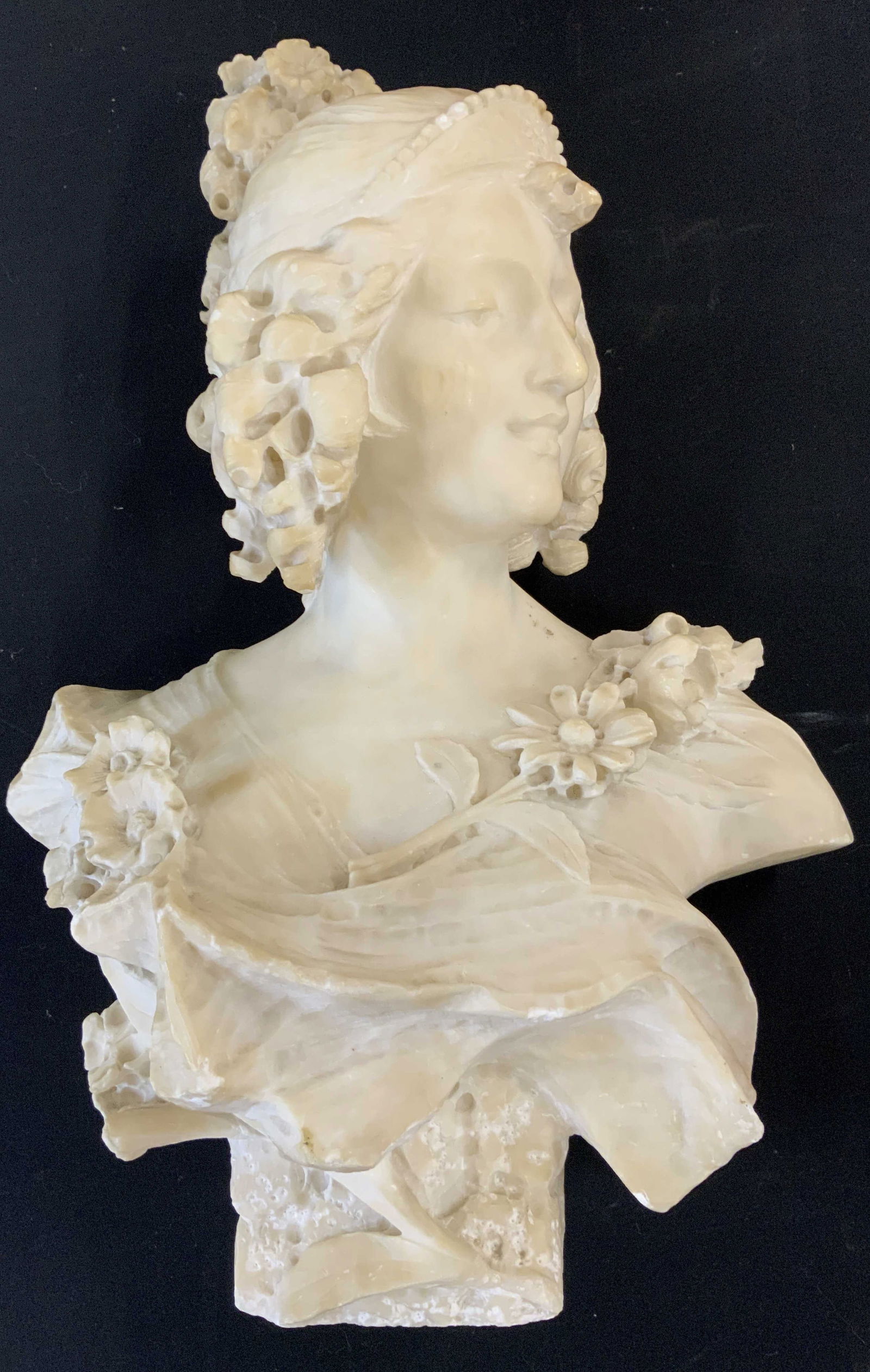 BACCHANTE After Albert-Ernest Carrier-Belleuse: This is a bust of a woman, often identified as a Bacchante or a young lady, after the French sculptor Albert-Ernest Carrier-Belleuse. Bust is white toned appears to be alabaster possibly marble. Alber