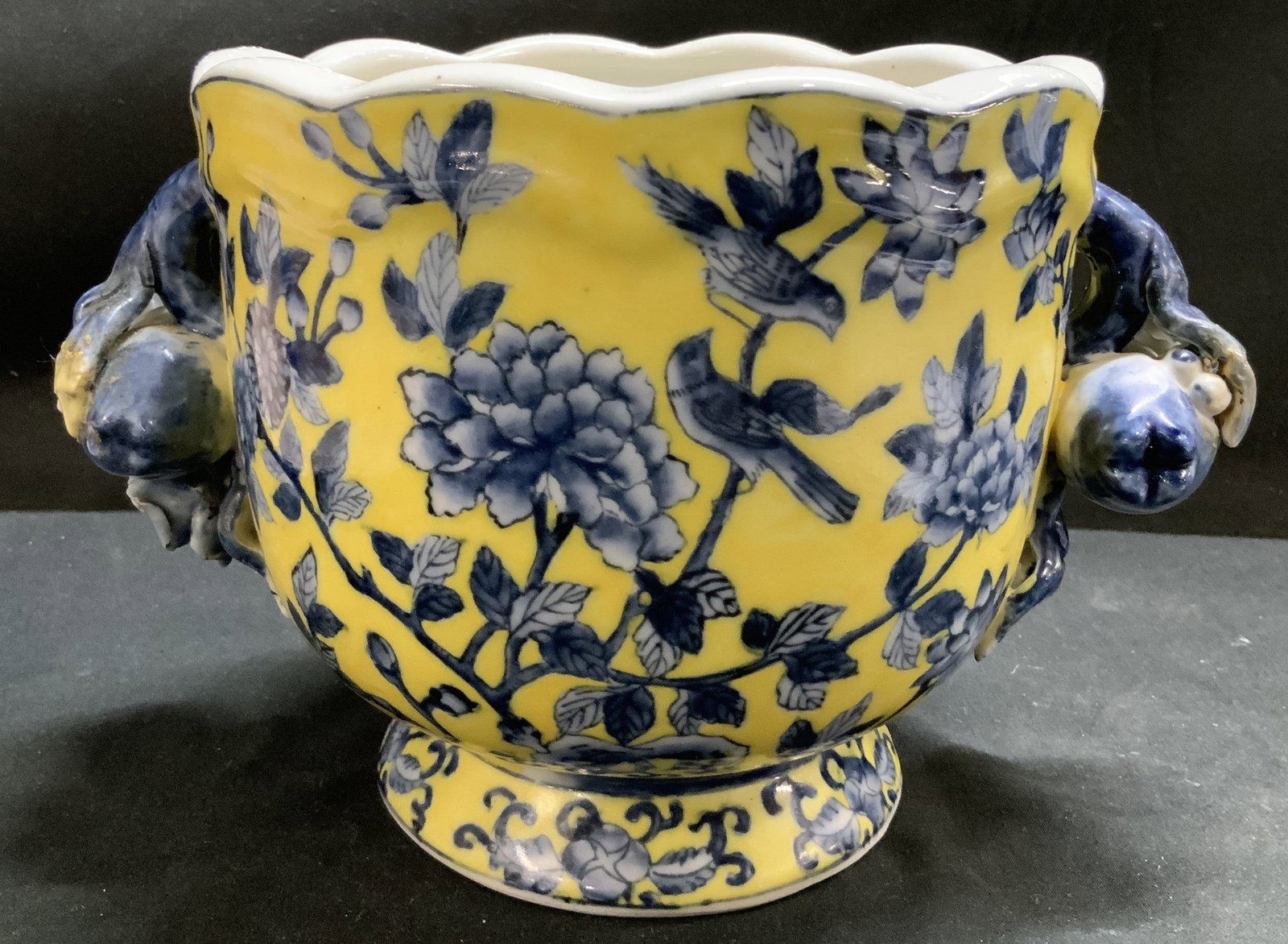 Vntg Hand Painted Porcelain Chinese Jardiniere: Jardiniere/planter features hand-painted cobalt blue floral & bird motifs. Sides of jardiniere has distinctive handles & footed base. Edge is scalloped. Surface wear consistent to age, use & exposure.
