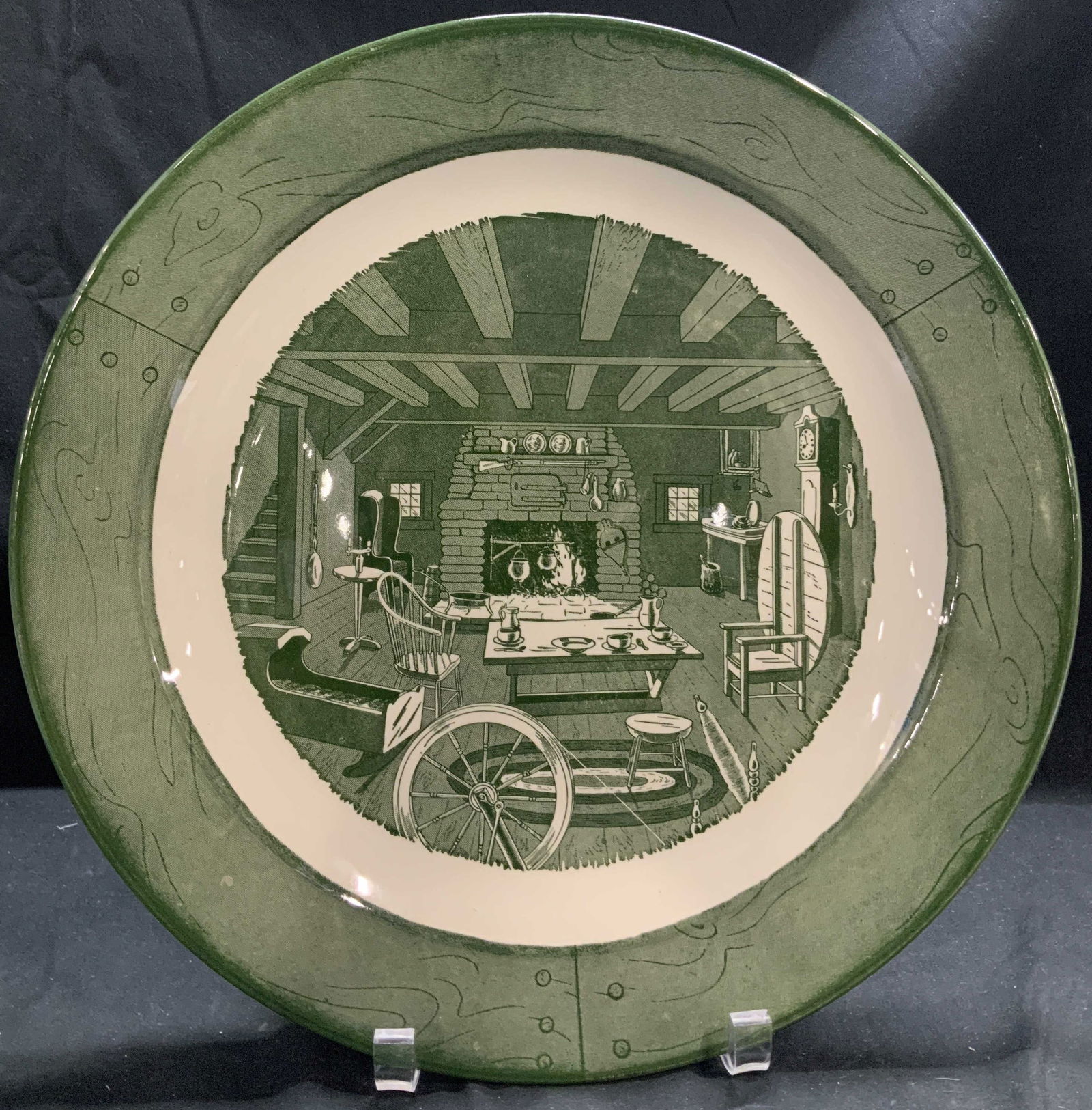 C.1950 Colonial Homestead By Royal Deco Plate: Plate is ceramic material & features an illustration of a colonial-era living room with a fireplace, furniture, & more. Signed & marked on underside. Reads, COLONIAL HOMESTEAD BY ROYAL. UNDERGLAZE CIR