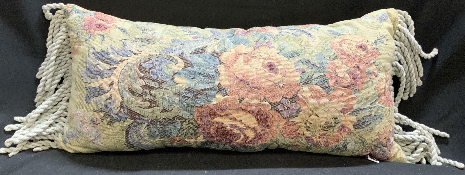 NEWPORT Floral Tapestry Fringed Lumbar Pillow: Lumbar pillow features a floral tapestry design in shades of pink, red, yellow, green & blue. Pillow has fringed ends. Signed & marked. Reads, NEWPORT. Surface wear consistent to age, use & exposure.