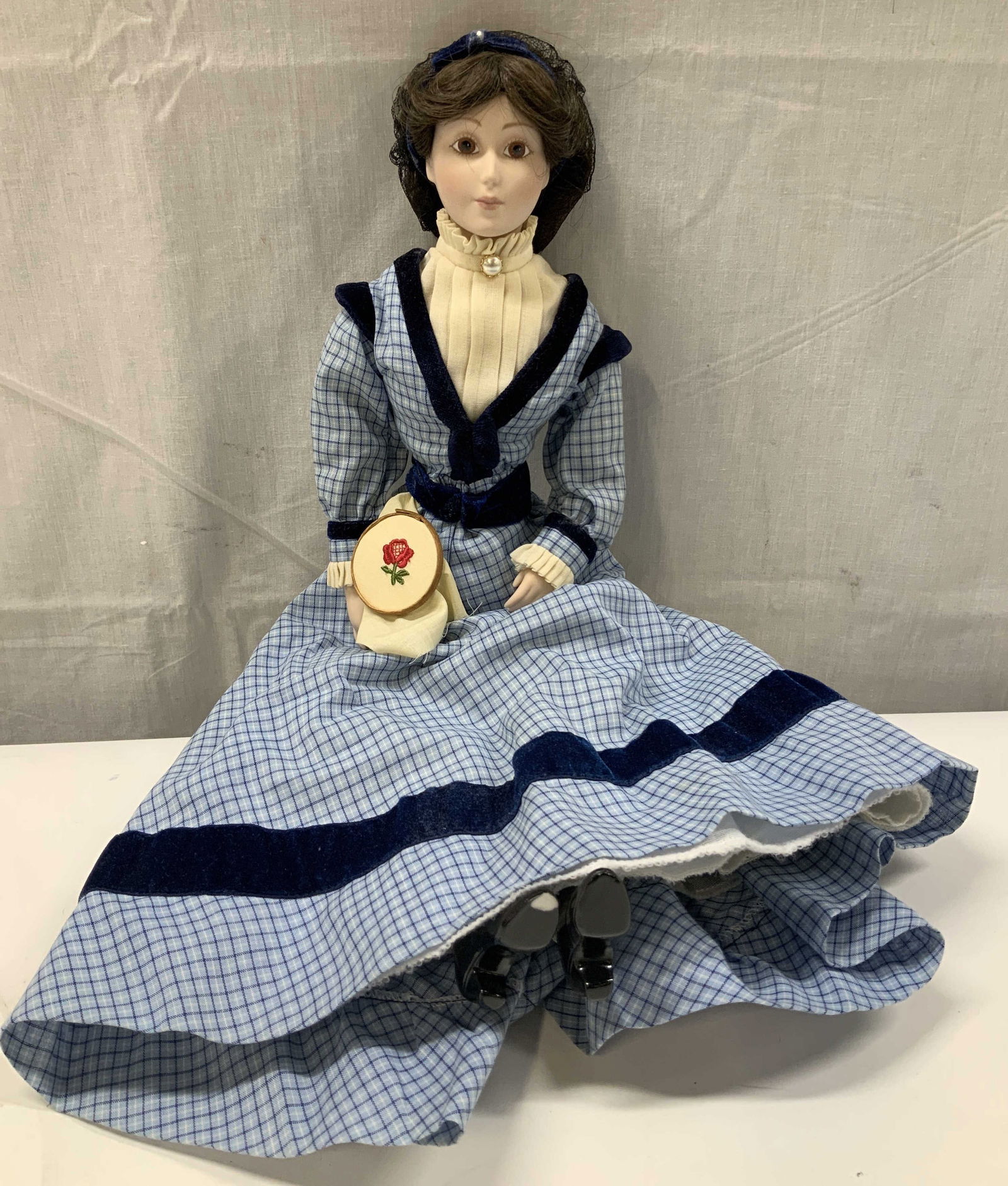 1984 Franklin Heirloom Meg Little Women Doll: Porcelain doll is Meg March from the Franklin Mints Little Women collection. Doll is dressed in a blue & white checkered dress w navy blue velvet trim. Signed & marked on neck of doll. Surface wear co