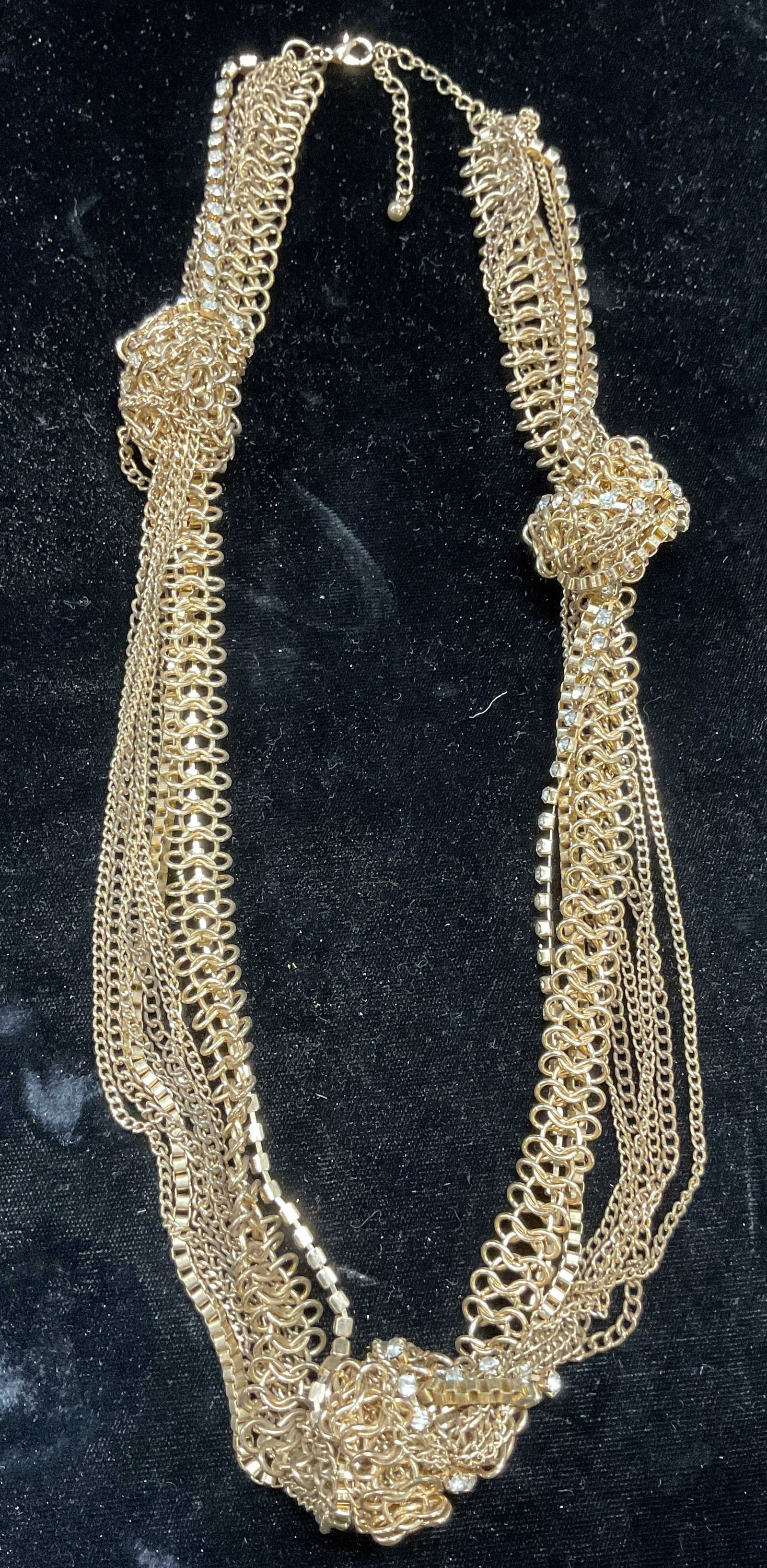 Vintage Gold Tone Multi Chain Crystal Necklace: Vintage gold tone knotted multi chain necklace with crystals. Drop length approx 11.5 inches. Some wear including scratching. Jewelry, estate jewelry, costume jewelry, cocktail jewelry, fashion jewelr
