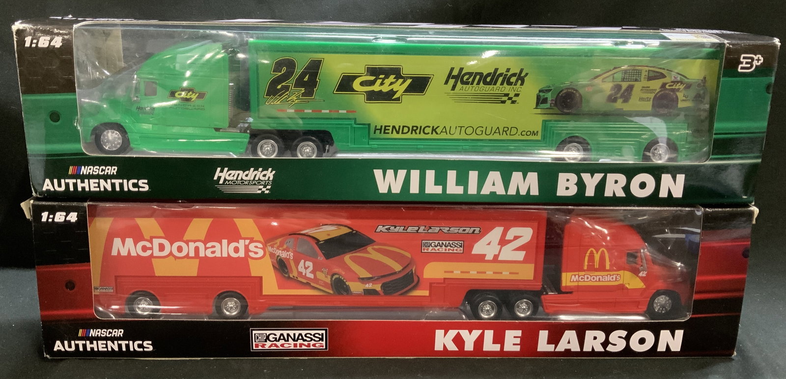 Lot 2 NASCAR Byron & Larson 1:64 Die-Cast Haulers: Lot includes, 2 NASCAR Authentics 1:64 scale die-cast haulers. Including, William Byrons #24 Hendrick Motorsports car & Kyle Larsons #42 McDonalds car. Haulers come with original box & feature McDonal