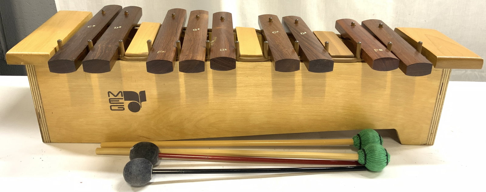 Set 5 MEG SONOR ORFF Wood Xylophone W Mallets: Lot includes 1 wooden xylophone trademark MEG (Appears to be SONOR ORFF). Xylophone has 10 keys. Lot also includes 4 mallets and PRACTICAL HITS ON PLAYING THE MALLET PERCUSSION BY WALLY BARNETT. Xylop