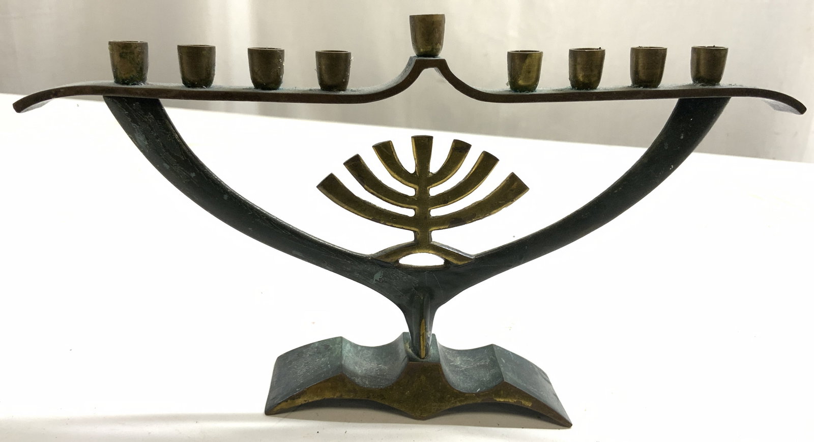 Vintage Brass Hanukkah Menorah ISRAEL: Underside is inscribed MADE IN ISRAEL. Menorah is vintage. Piece is brass. Green and gold toned menorah. Piece measures approx 10.25 inches wide 5.5 inches tall. Menorah, vintage menorah, brass menora