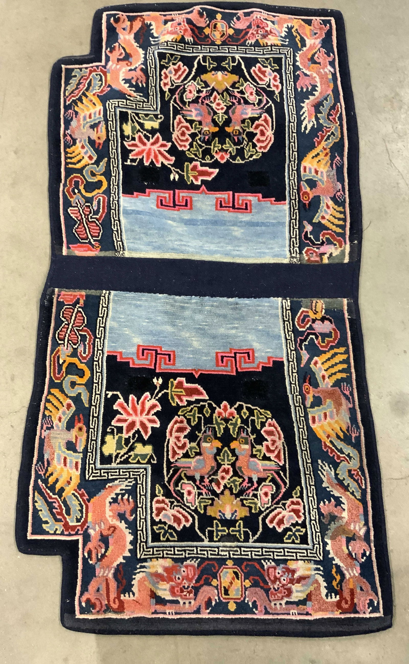 Vintage Handmade Chinese Art Deco Wool Rug: Rug is handmade and wool. Piece appears to be vintage possibly antique. Piece has intricate multi toned floral, bird, Phoenix and leaf detail. Rug measures approximately 55 inches long 28 inches wide.