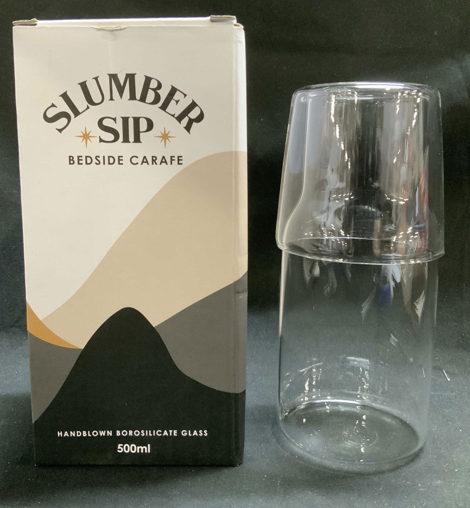 Slumber Sip Beside Carafe W Original Box: Box reads, Slumber Sip. Beside Carafe. Comes with original box. Made from robust heat-resistant handblown borosilicate glass. The glass can be placed on top of the carafe to act as a lid. Surface wear