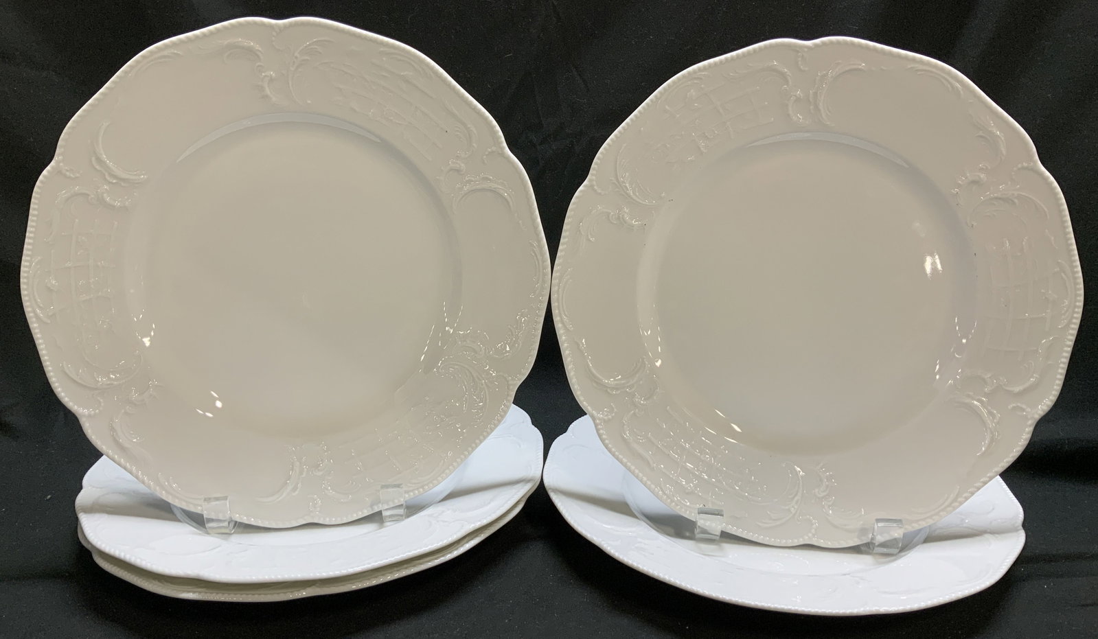 Lot 5 Rosenthal Sanssouci Porcelain Plates GERMANY: Lot 5 Rosenthal Sanssouci Porcelain Plates GERMANY Porcelain plates feature a decorative & scalloped textured rim. Plates feature an embossed scroll like design. Signed & marked on underside. Reads, R