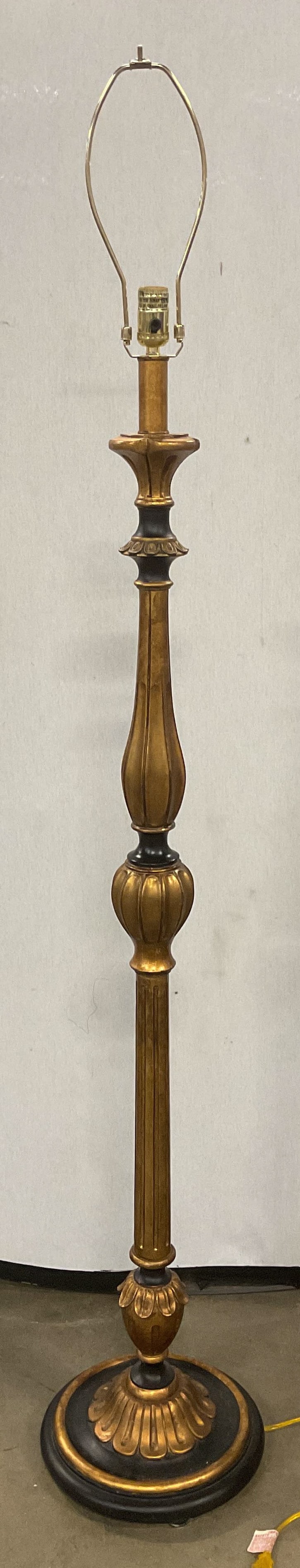 Black & Gilt Decorative Pillar Floor Lamp: Black and gilt pillar floor lamp. Molded detail with curved design. Heavy composite material. Measures approx 56 inches tall excluding finial, 12 inches wide at base. Not tested for function. Piece is