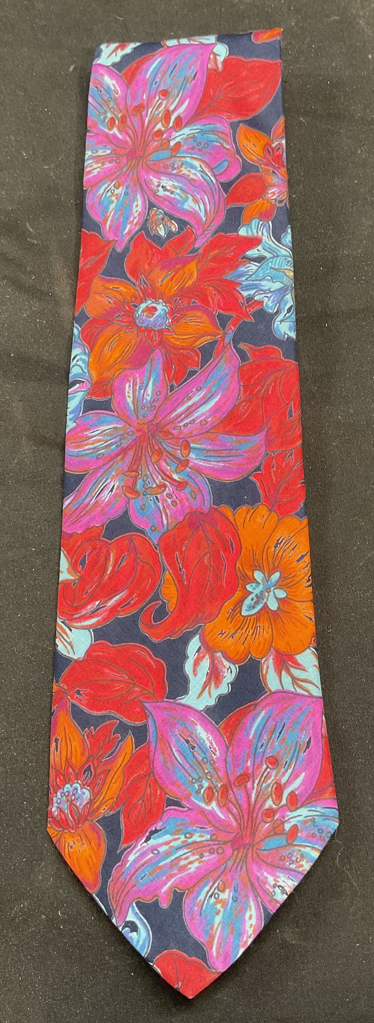 Jos A Bank Blue Red Floral Print Cotton Tie USA: Jos A Bank floral print cotton tie in blue, red, and orange. Made in USA. Measures approx 53 inches long. Some wear to material consistent with exposure. Jos a bank tie, designer tie, cotton tie, flor